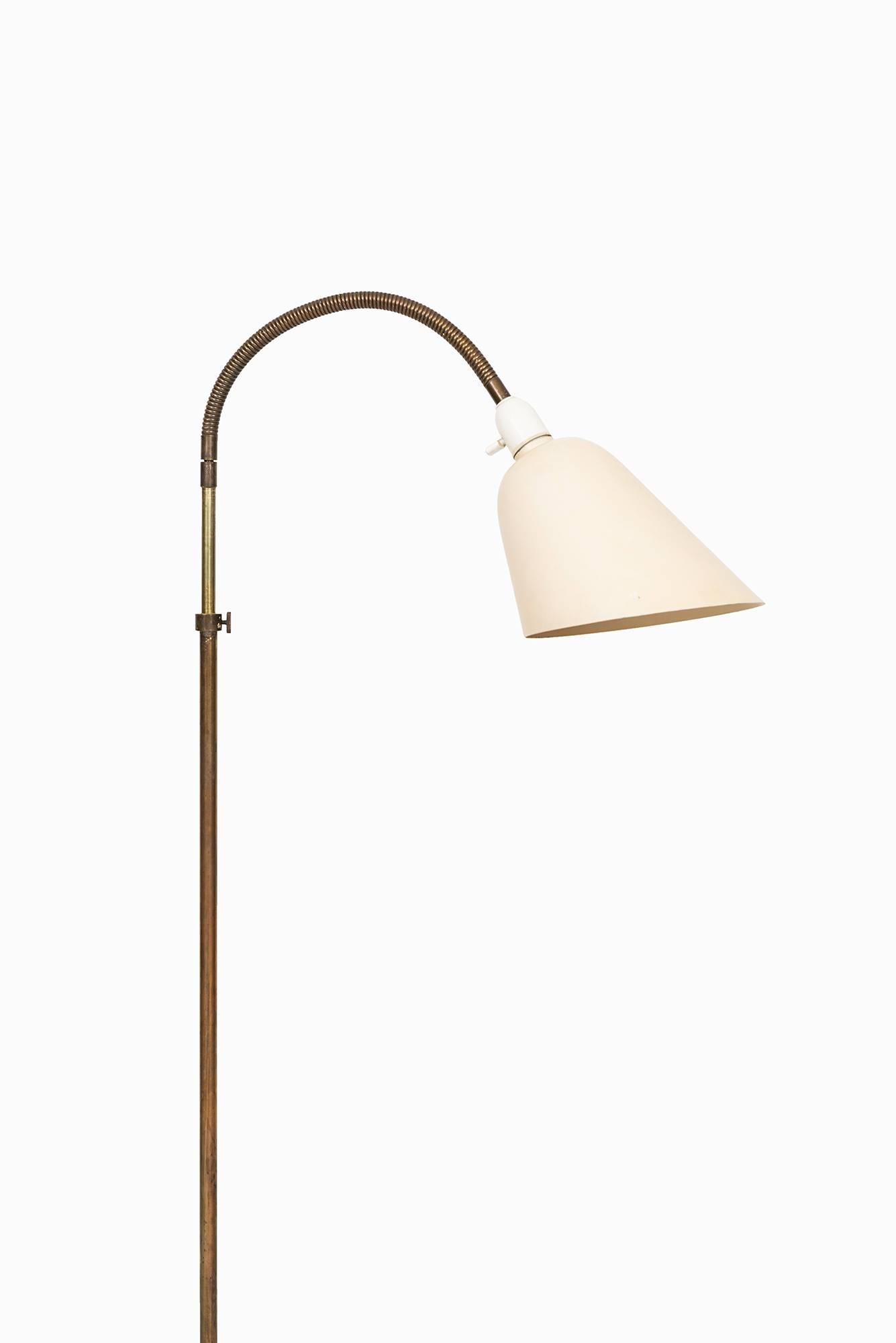 Rare early floor lamp designed by Arne Jacobsen. Produced by Louis Poulsen in Denmark.