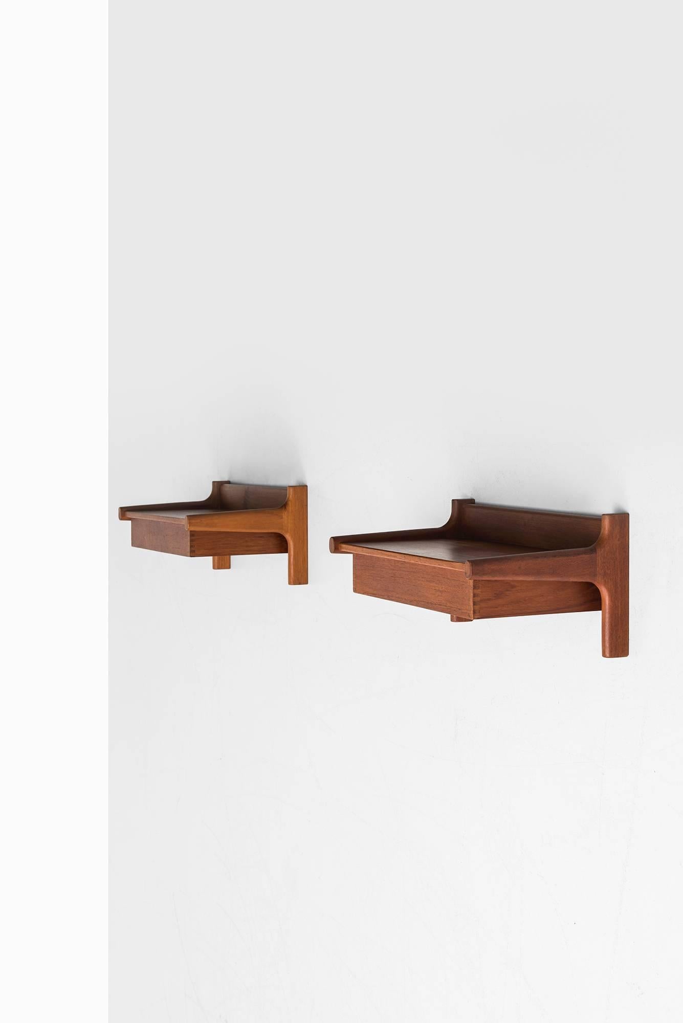 Rare pair of wall hanged bedside tables designed by Børge Mogensen. Produced by Søborg Møbelfabrik in Denmark.
