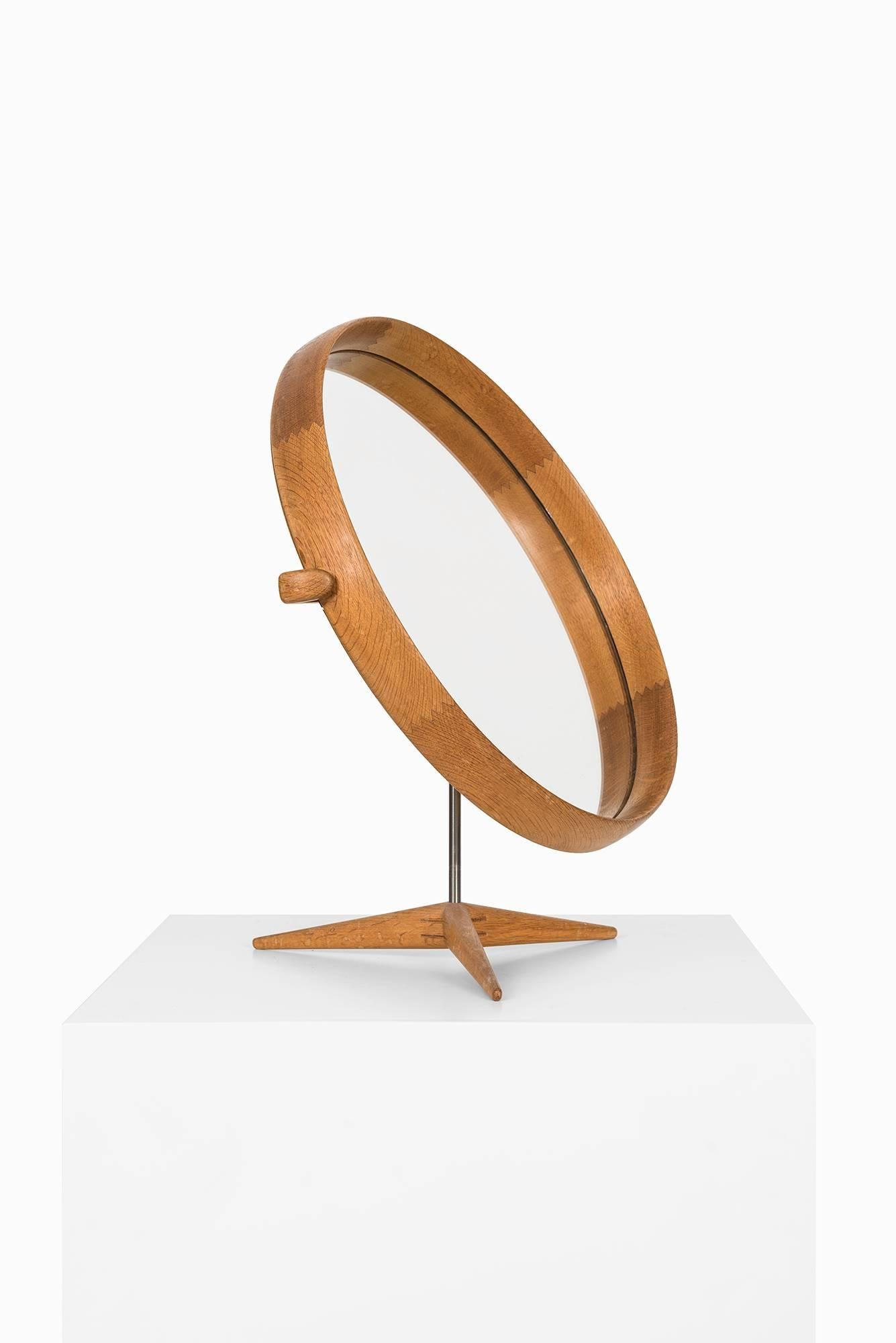 Rare table mirror designed by Uno & Östen Kristiansson. Produced by Luxus in Vittsjö, Sweden.