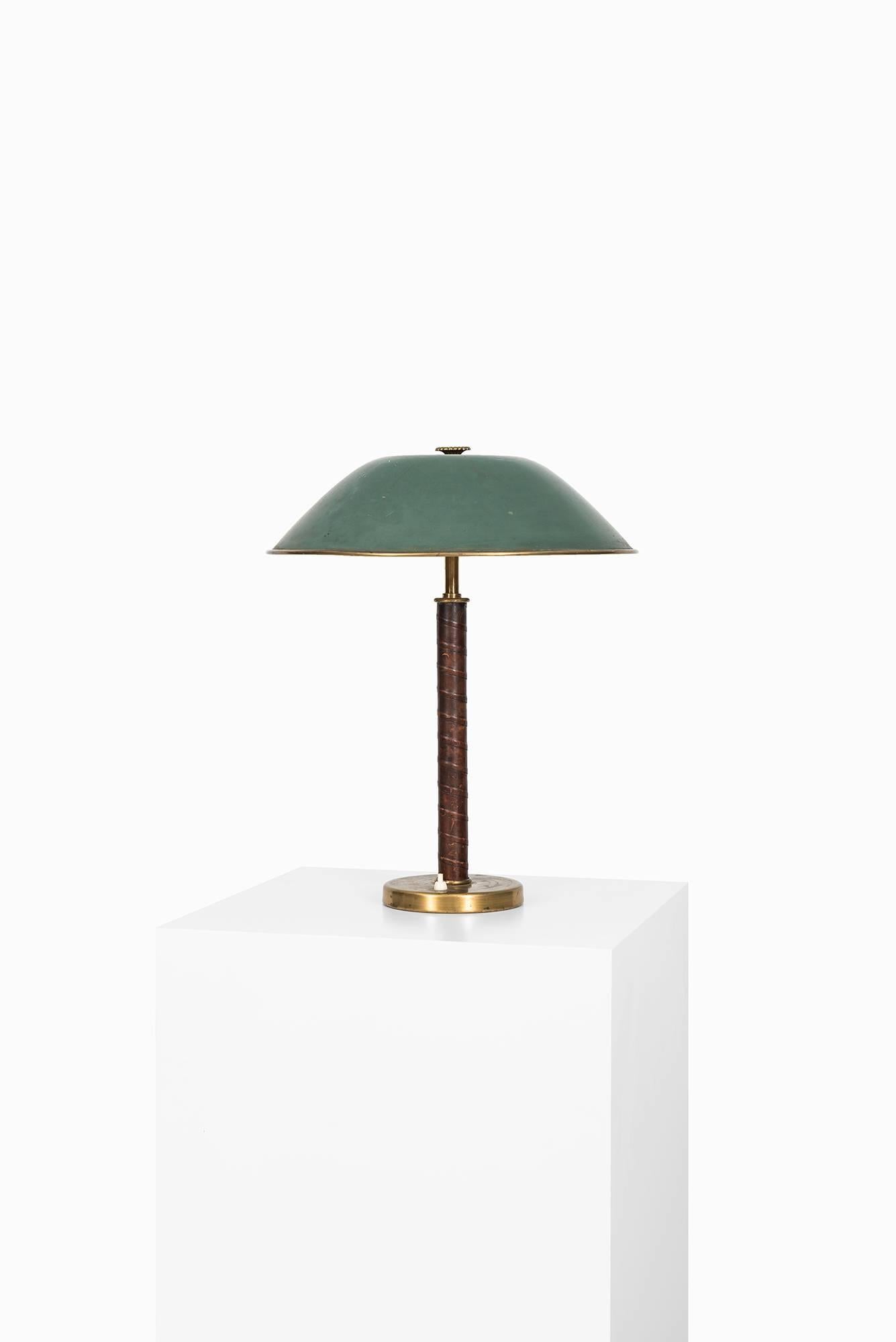 Rare table lamp produced by NK in Sweden.