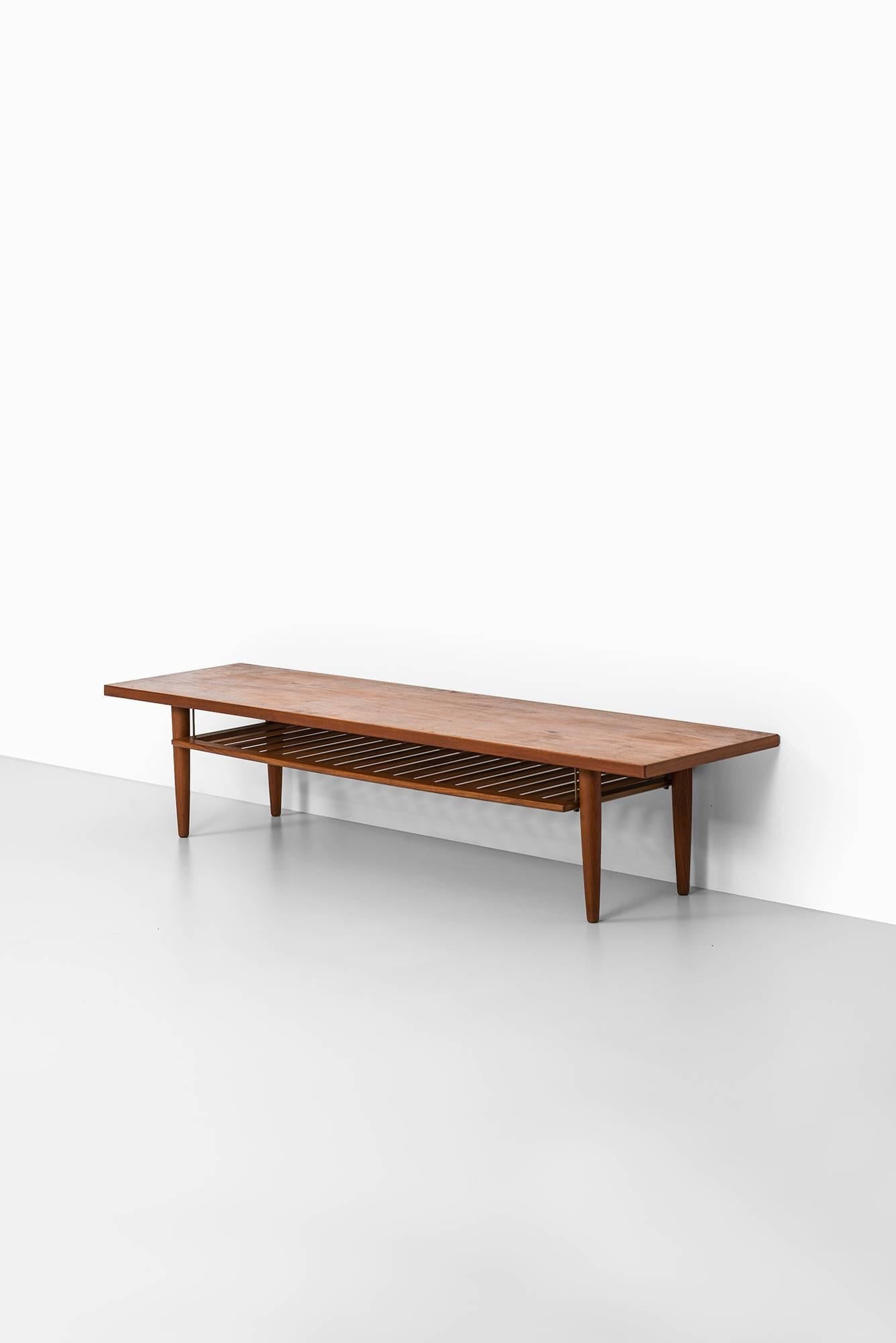 Scandinavian Modern Long Side Table or Coffee Table with Magazine Rack Produced in Sweden