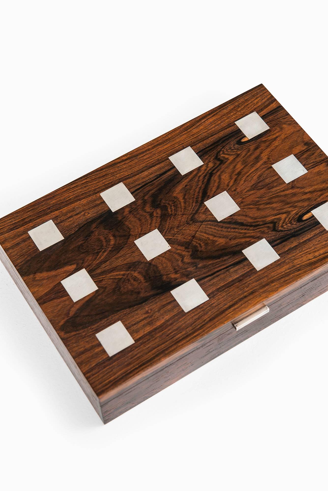 Rare rosewood box with silver inlays designed by Hans Hansen. Produced in Denmark.