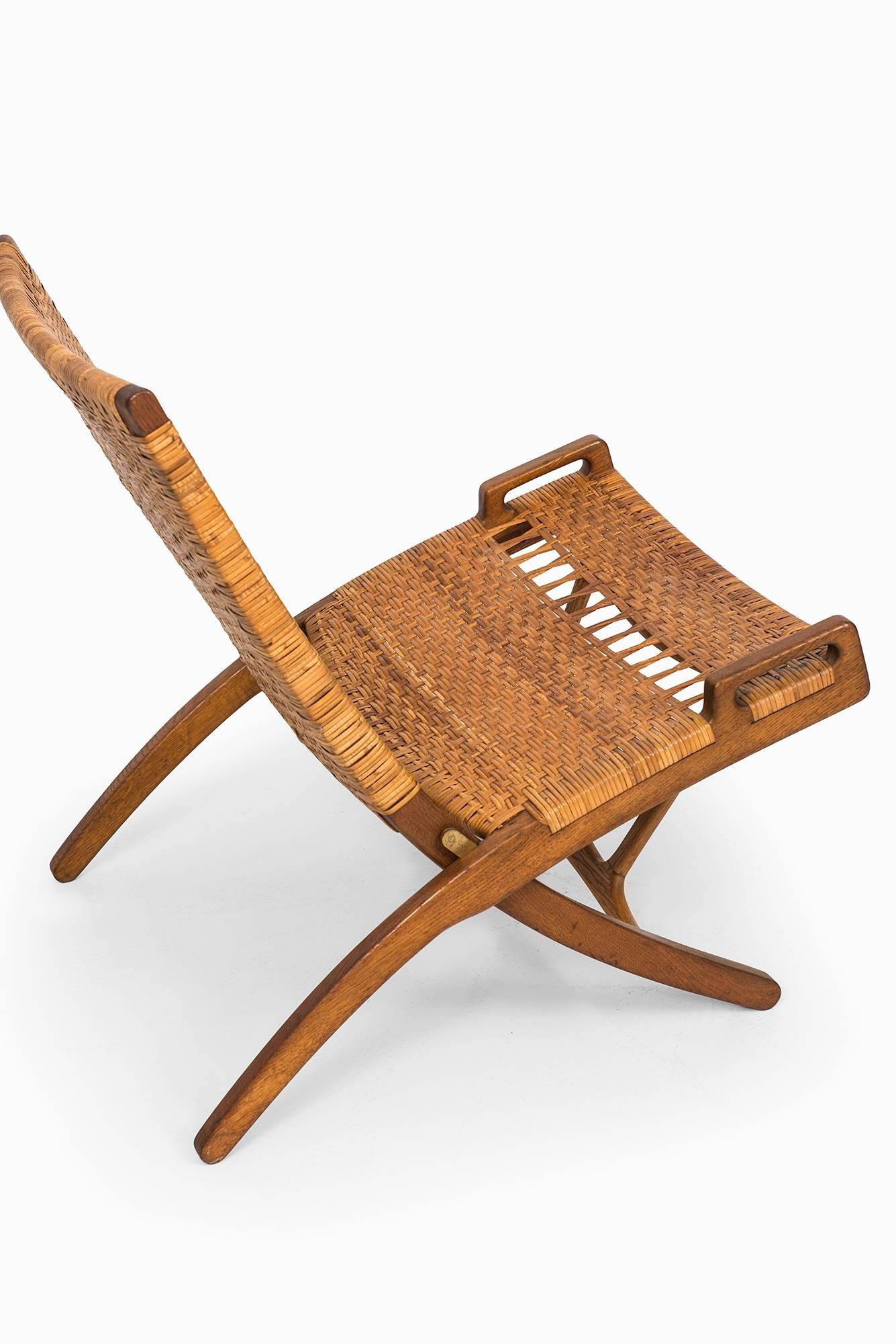 Rare folding chair model JH512 designed by Hans Wegner. Produced by Johannes Hansen in Denmark.