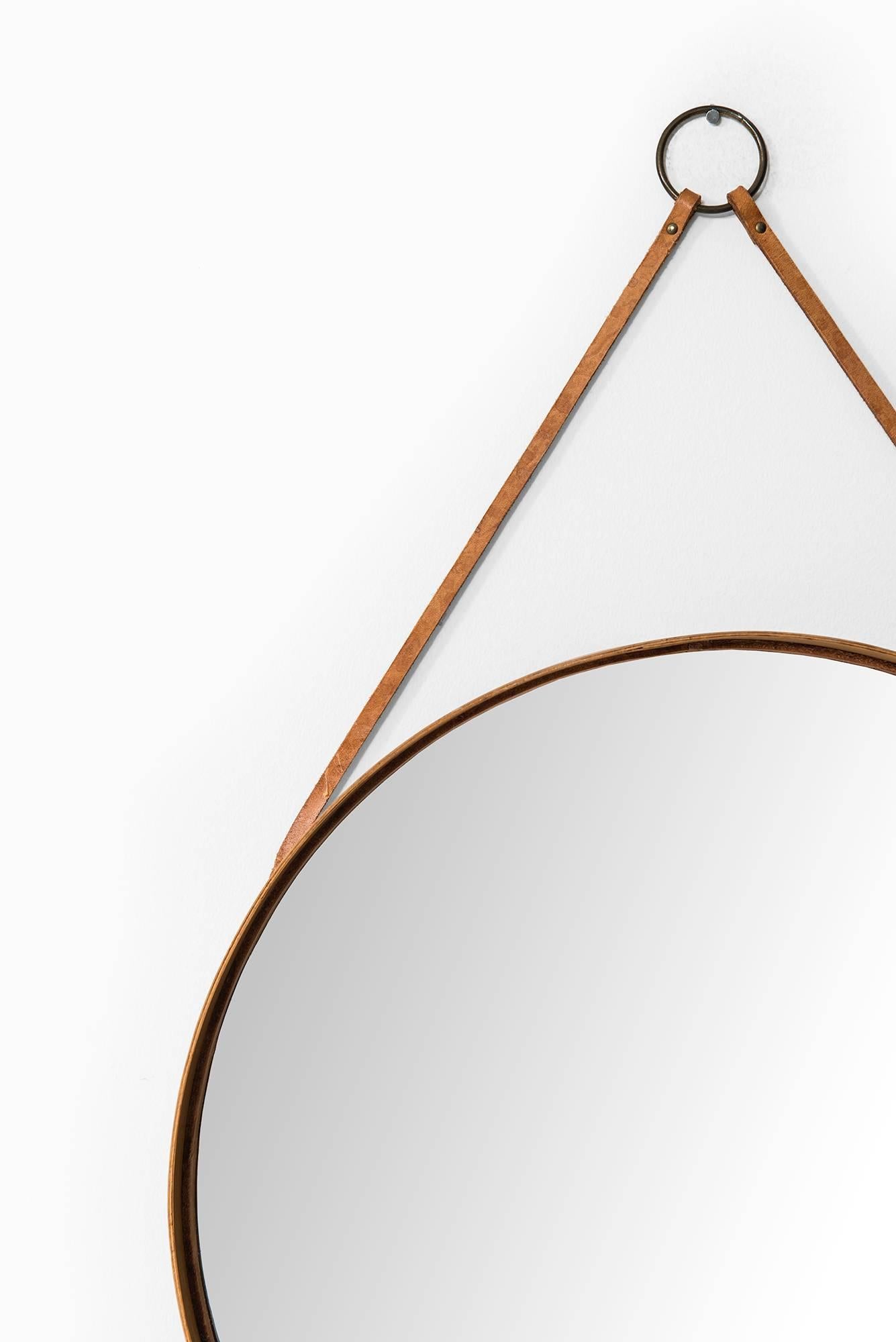 Rare mirror in oak, brass and leather. Produced by Glas Mäster in Markaryd, Sweden.