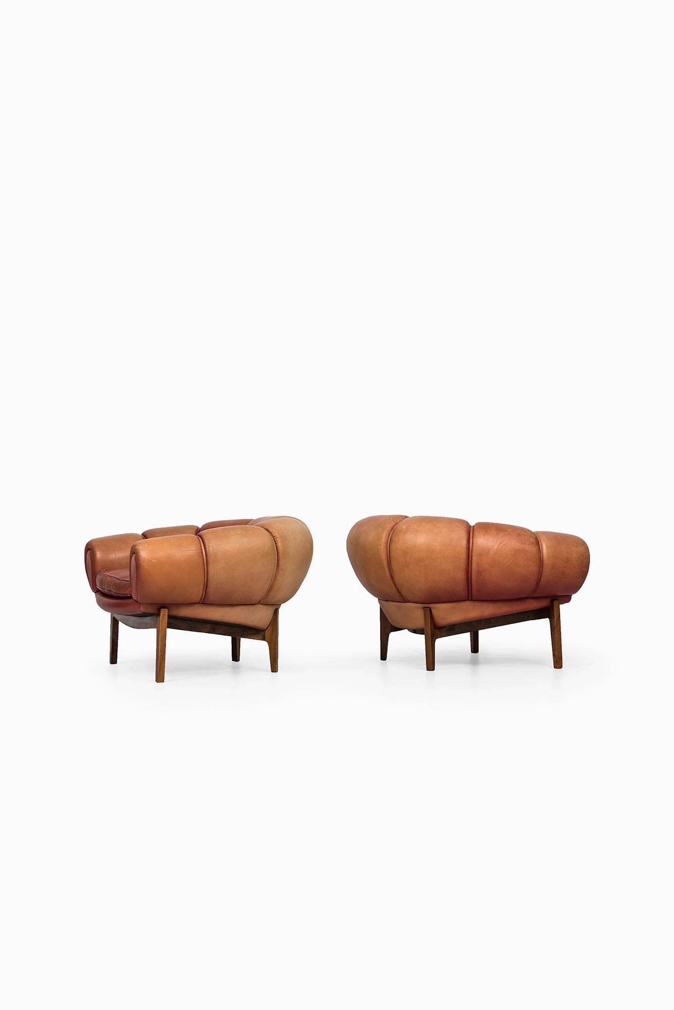 Very rare pair of easy chairs model Croissant designed by Illum Wikkelsø. Produced by Holger Christiansen in Denmark.