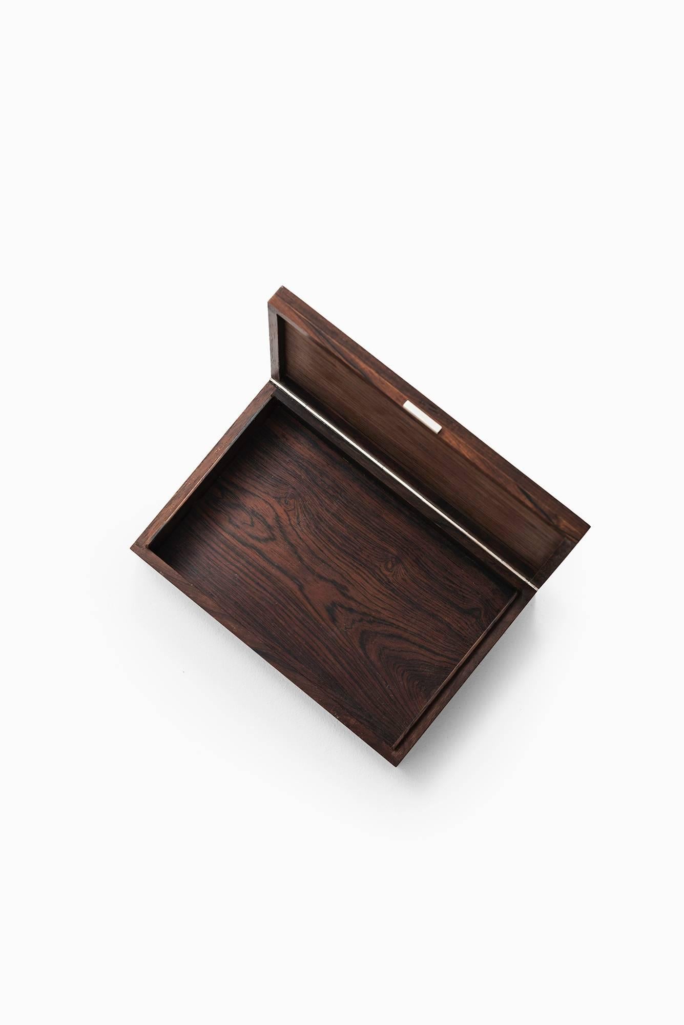 Rare rosewood box with silver inlays designed by Hans Hansen. Produced in Denmark.