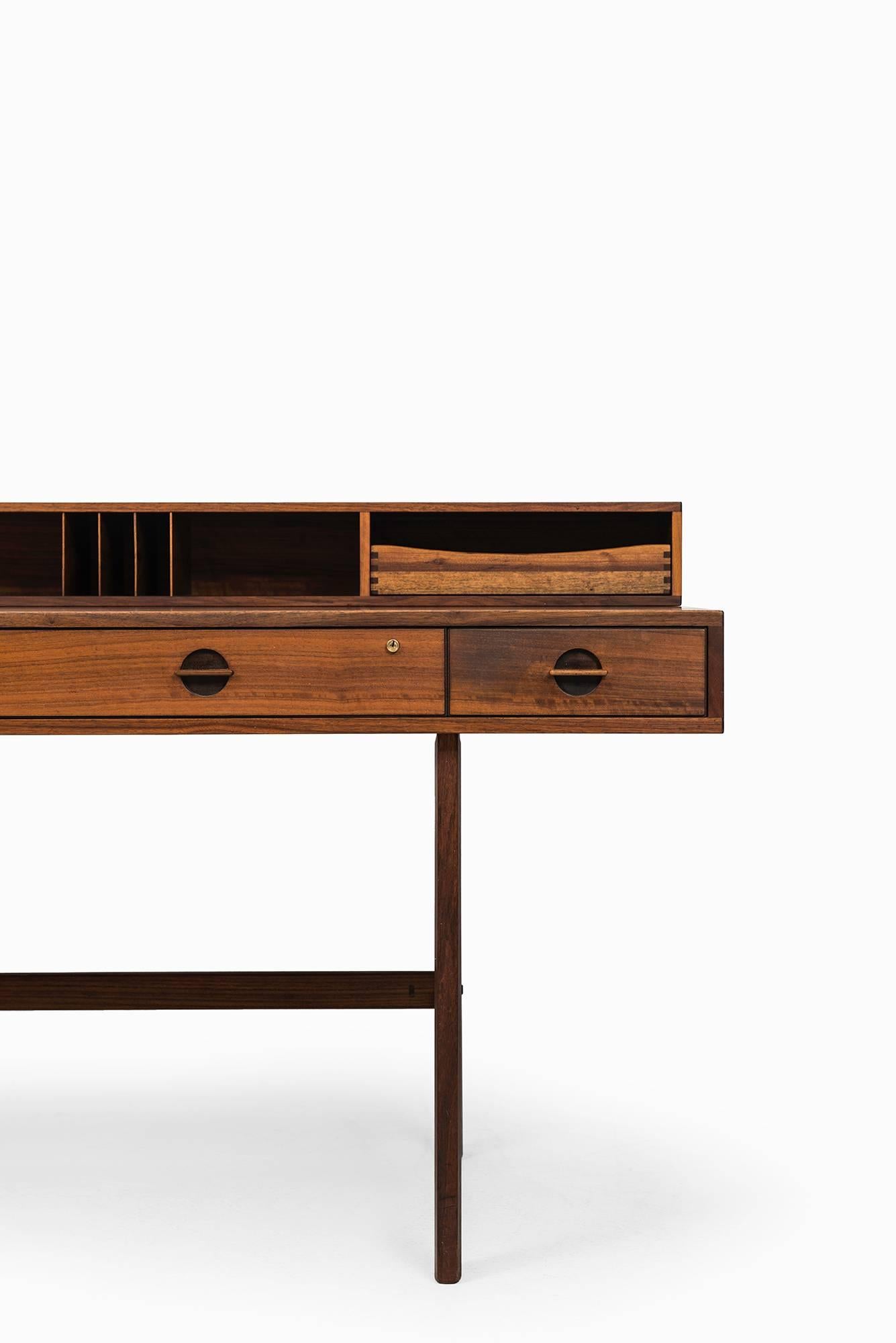 Rare flip-down and freestanding desk in teak designed by Jens Quistgaard. Produced by Peter Løvig Nielsen in Denmark.