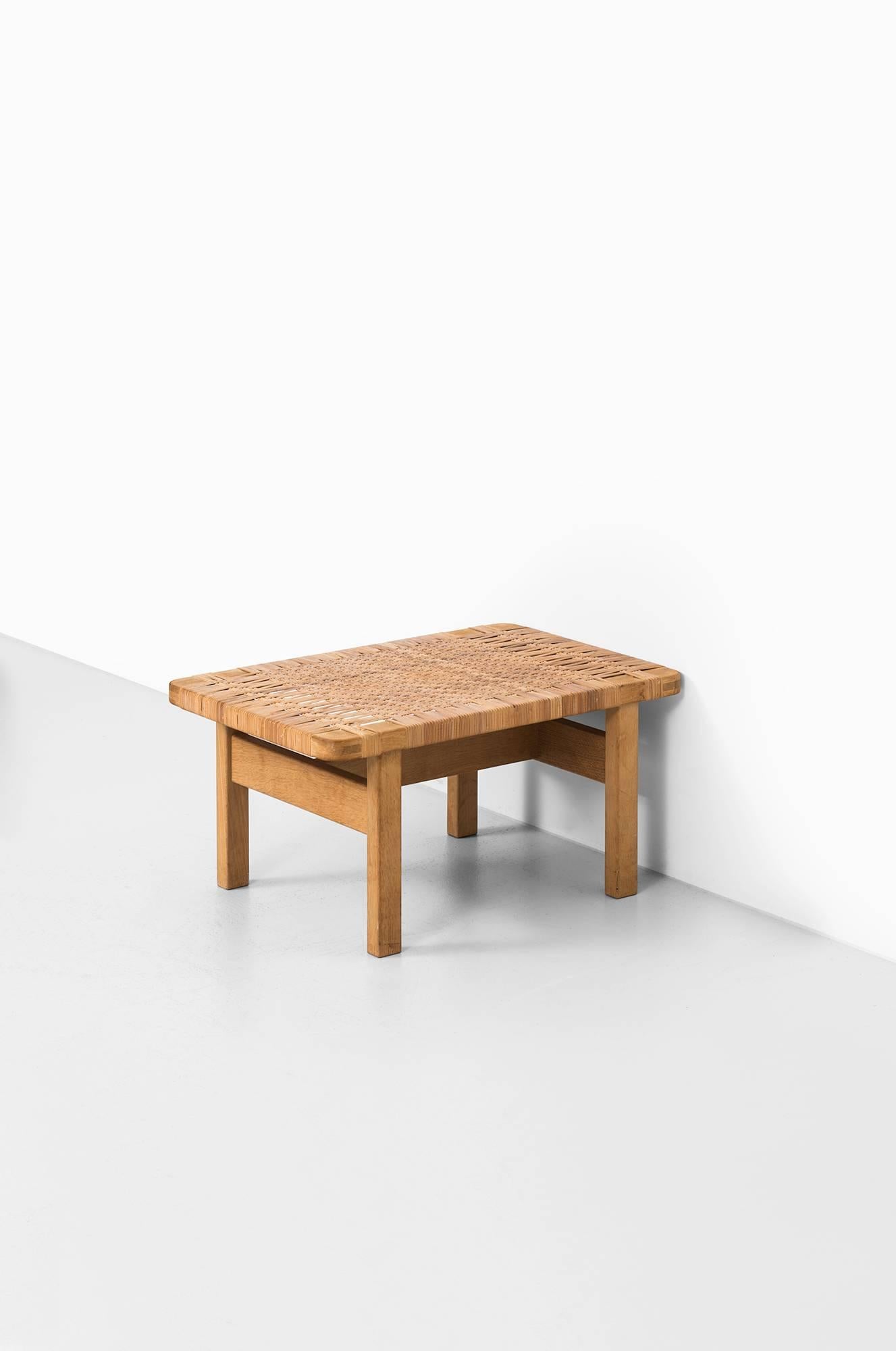 Rare side table in oak and cane designed by Børge Mogensen. Produced by Fredericia Stolefabrik in Denmark.