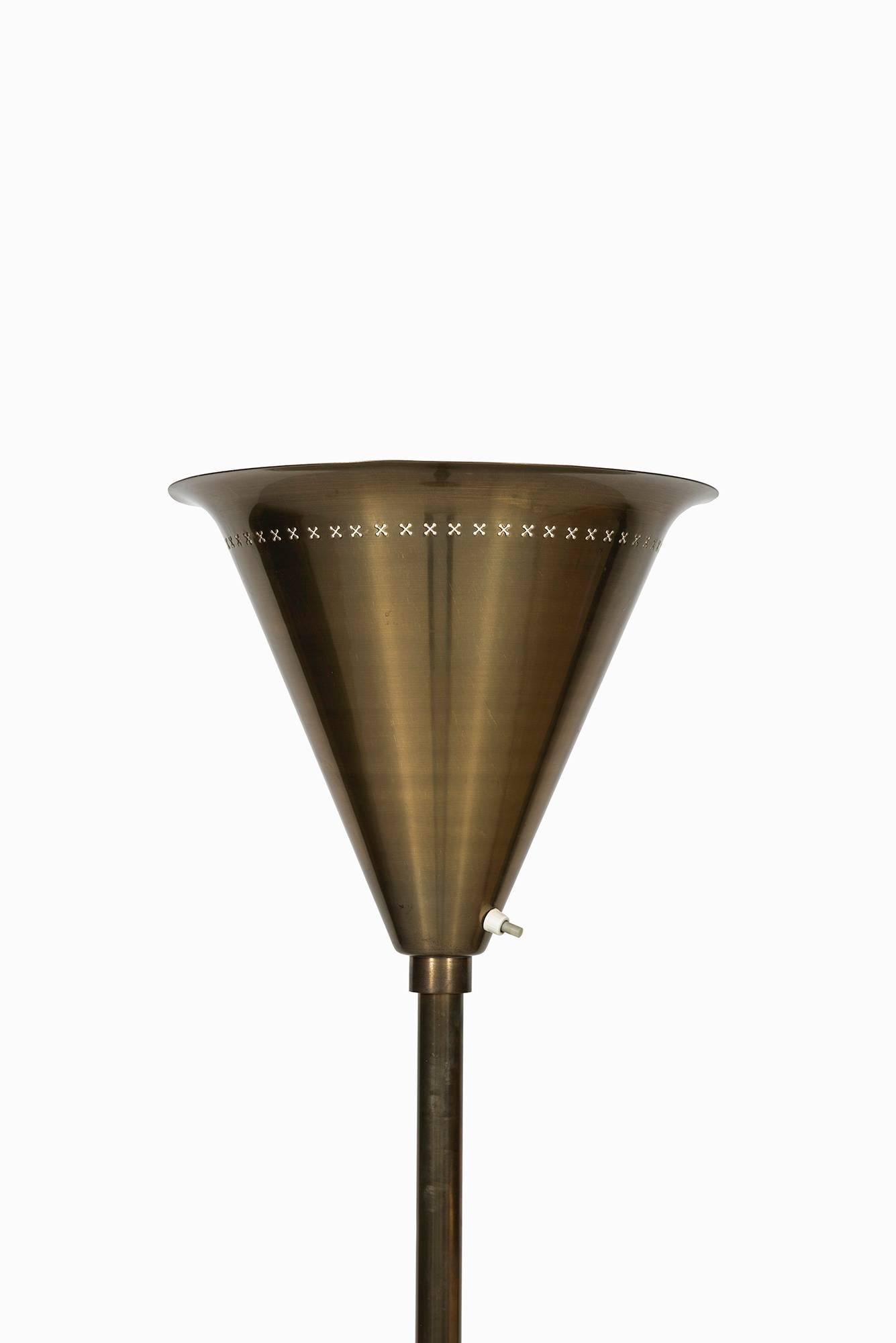 Floor lamp / uplight in brass produced in Denmark.