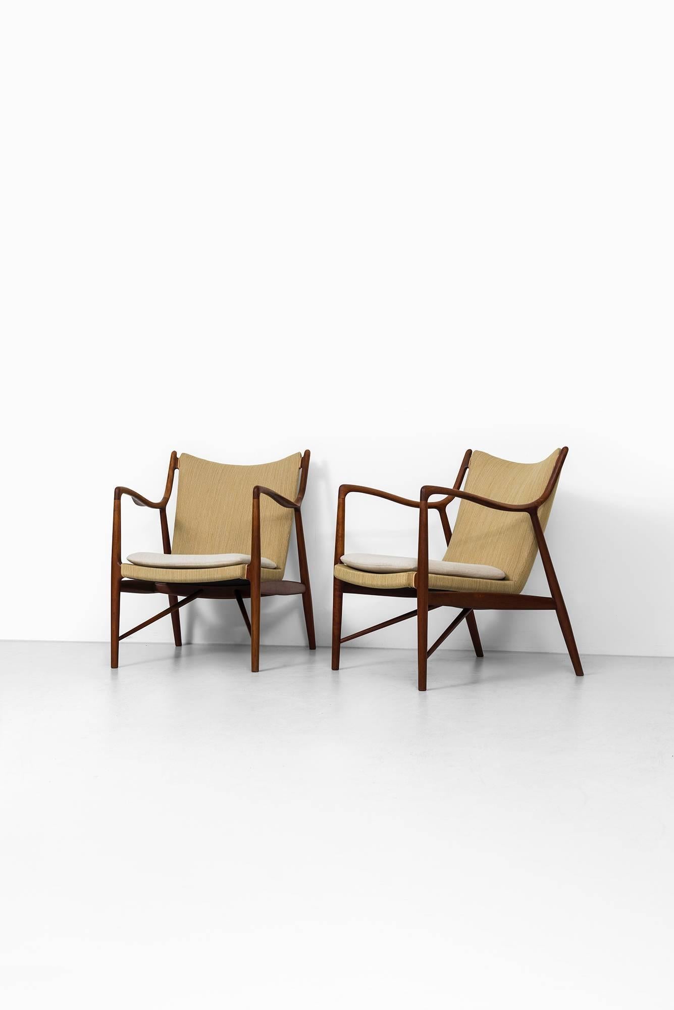 Rare pair of NV-45 easy chairs designed by Finn Juhl. Produced by Niels Vodder in Denmark.