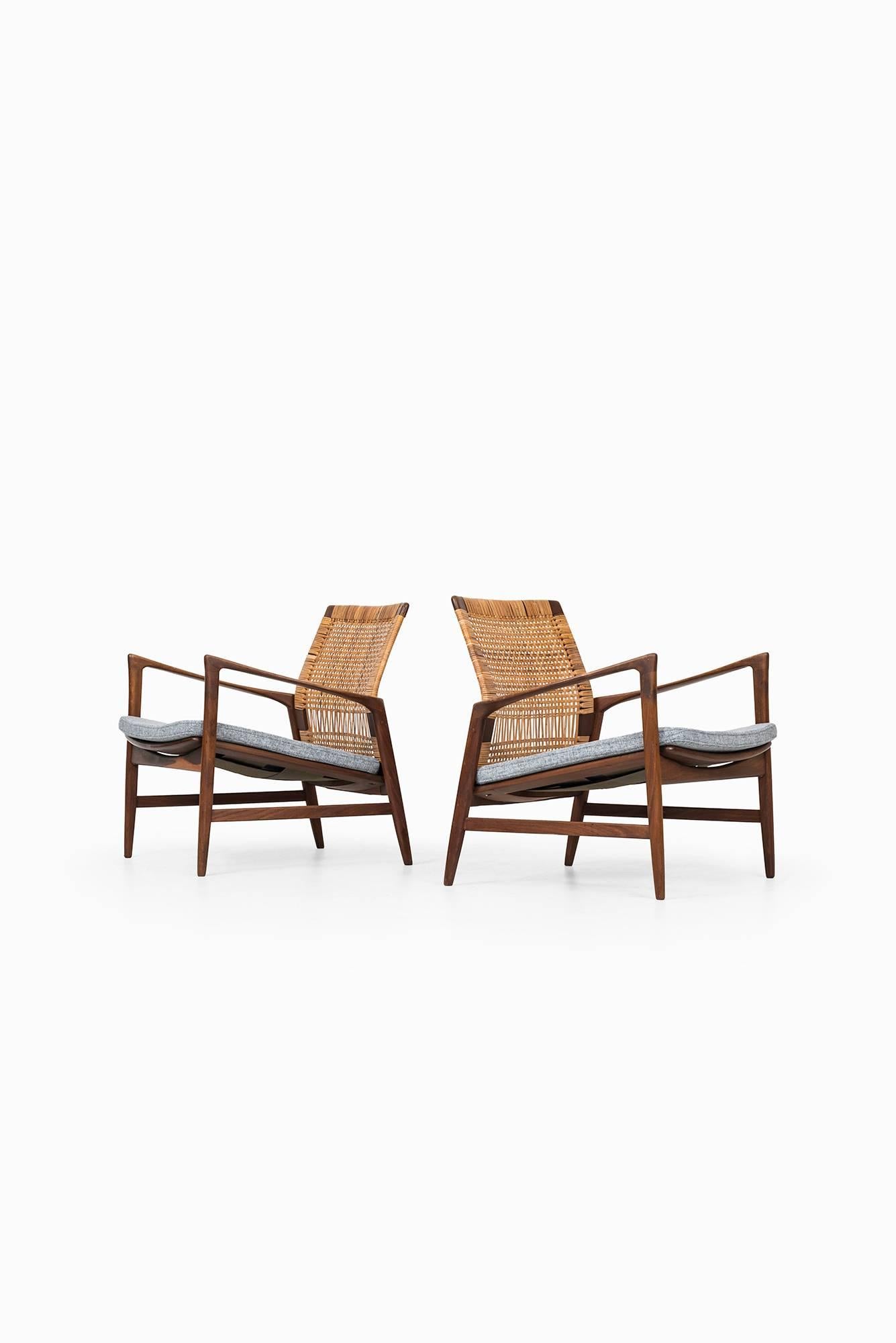 Rare pair of easy chairs model Åre designed by Ib Kofod-Larsen. Produced by OPE in Sweden.
