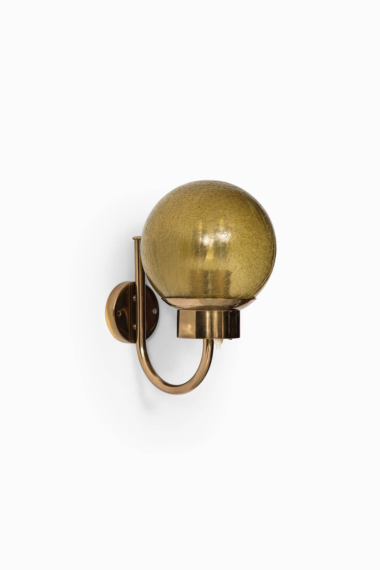 Pair of wall lamps model V-118 in brass and glass. Produced by Bergboms in Sweden.