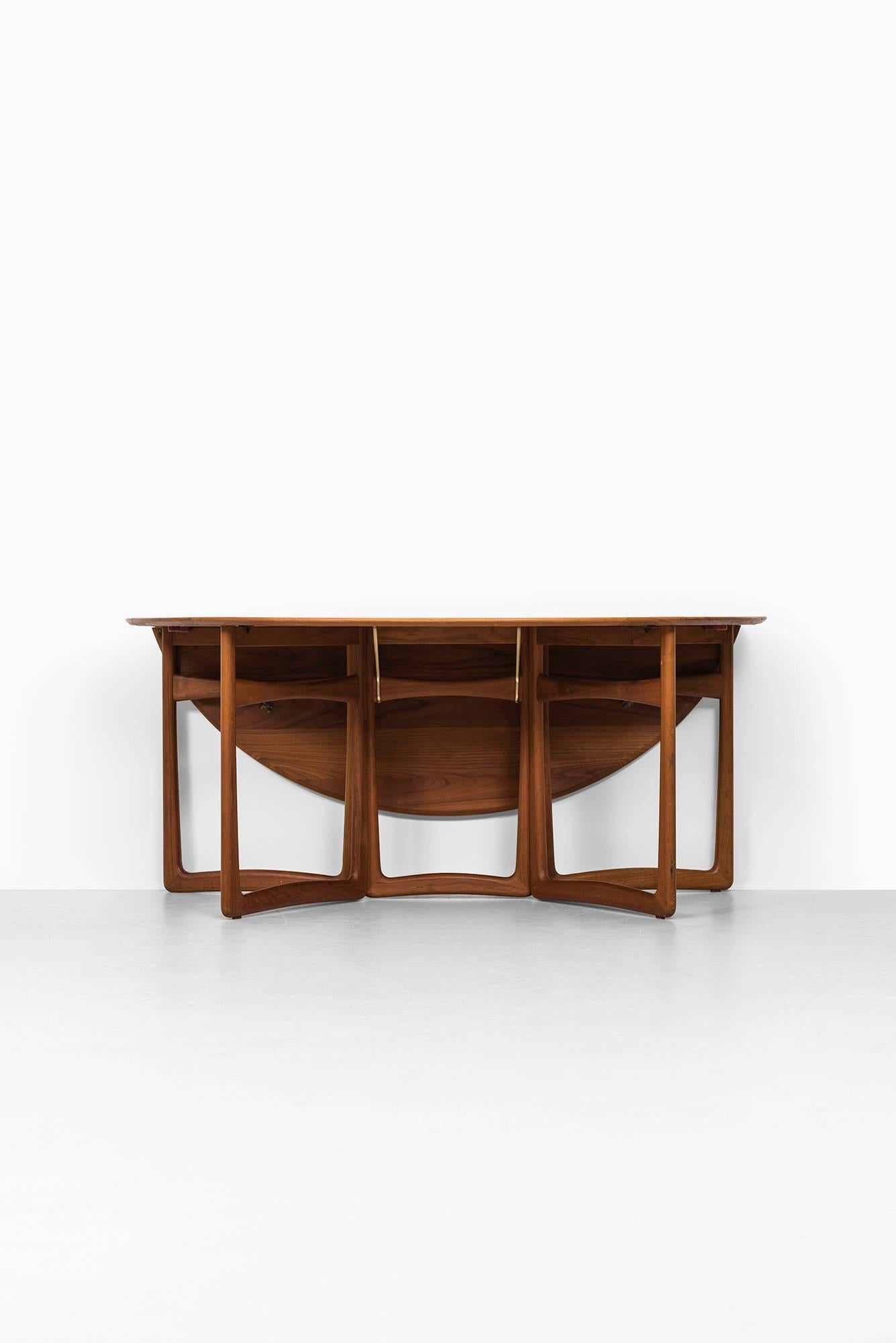 Rare drop-leaf dining and console table designed by Peter Hvidt & Orla Mølgaard-Nielsen. Produced by France & Son in Denmark.