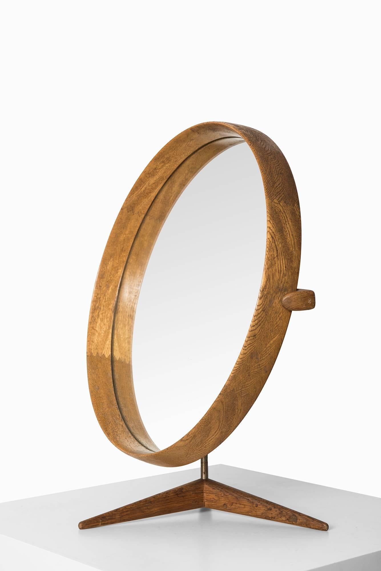 Rare table mirror designed by Uno & Östen Kristiansson. Produced by Luxus in Vittsjö, Sweden.