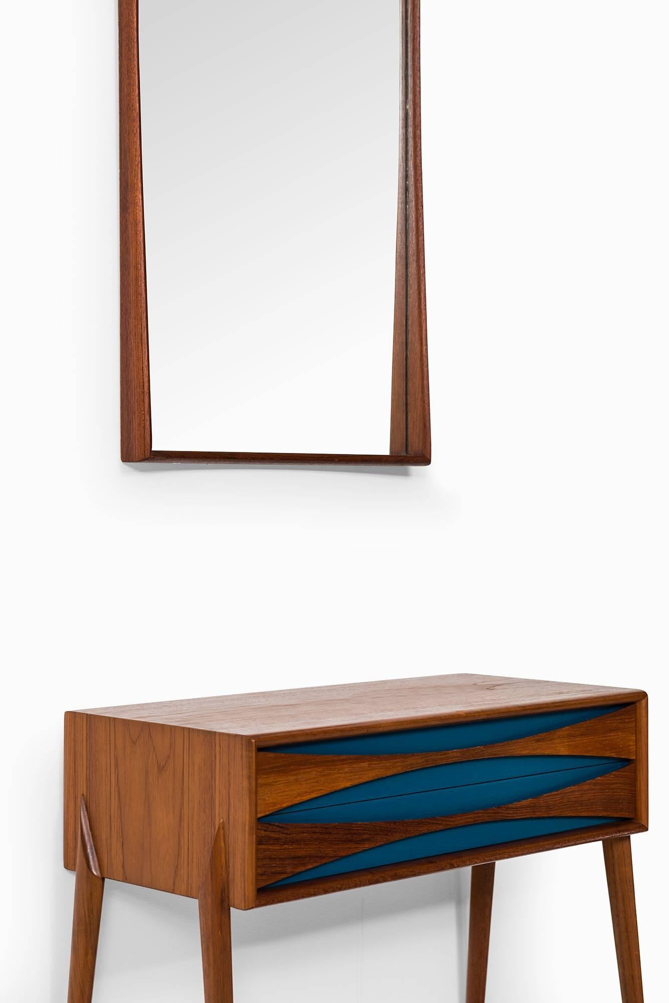 Rare side table and mirror in the manner of Arne Vodder. Produced by Glas & Trä Hovmantorp in Sweden.