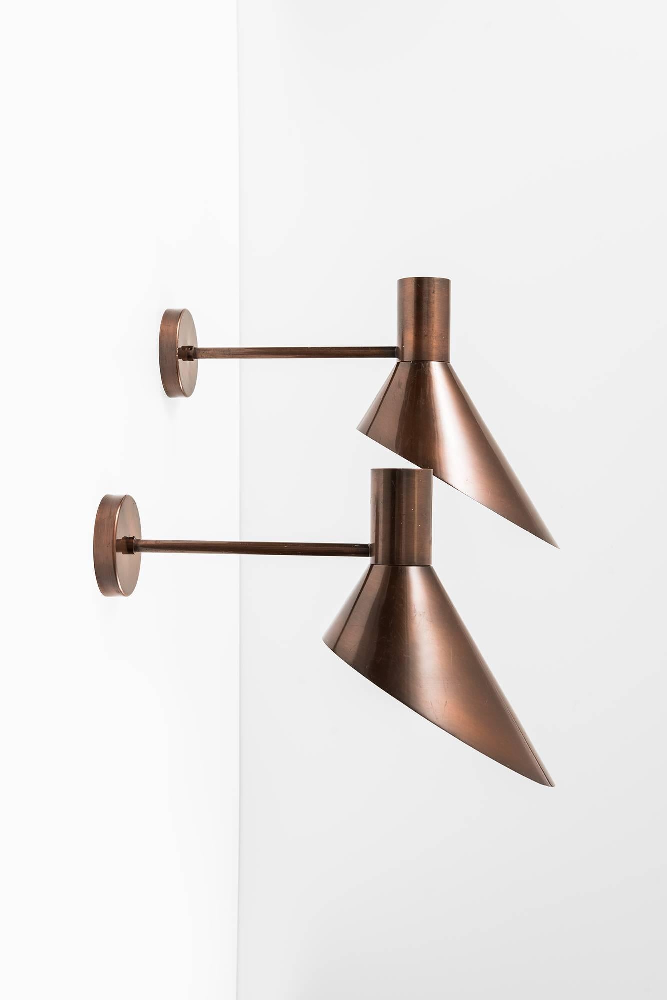 Rare pair of big wall lamps in copper. Produced in Denmark.