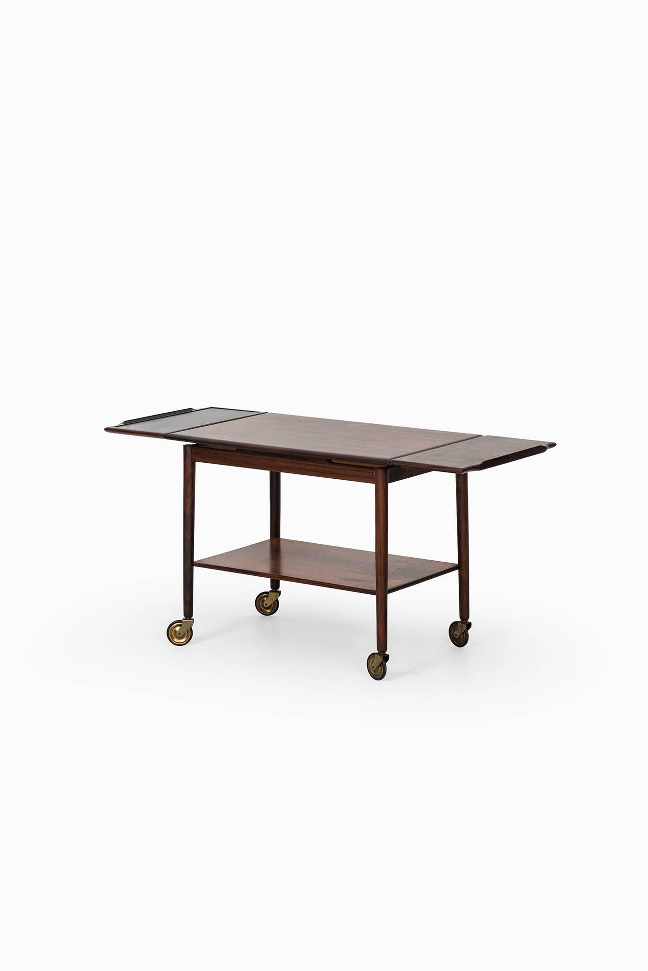 Trolley in rosewood and black formica. Produced by Mogens Hansen in Svendborg in Denmark.