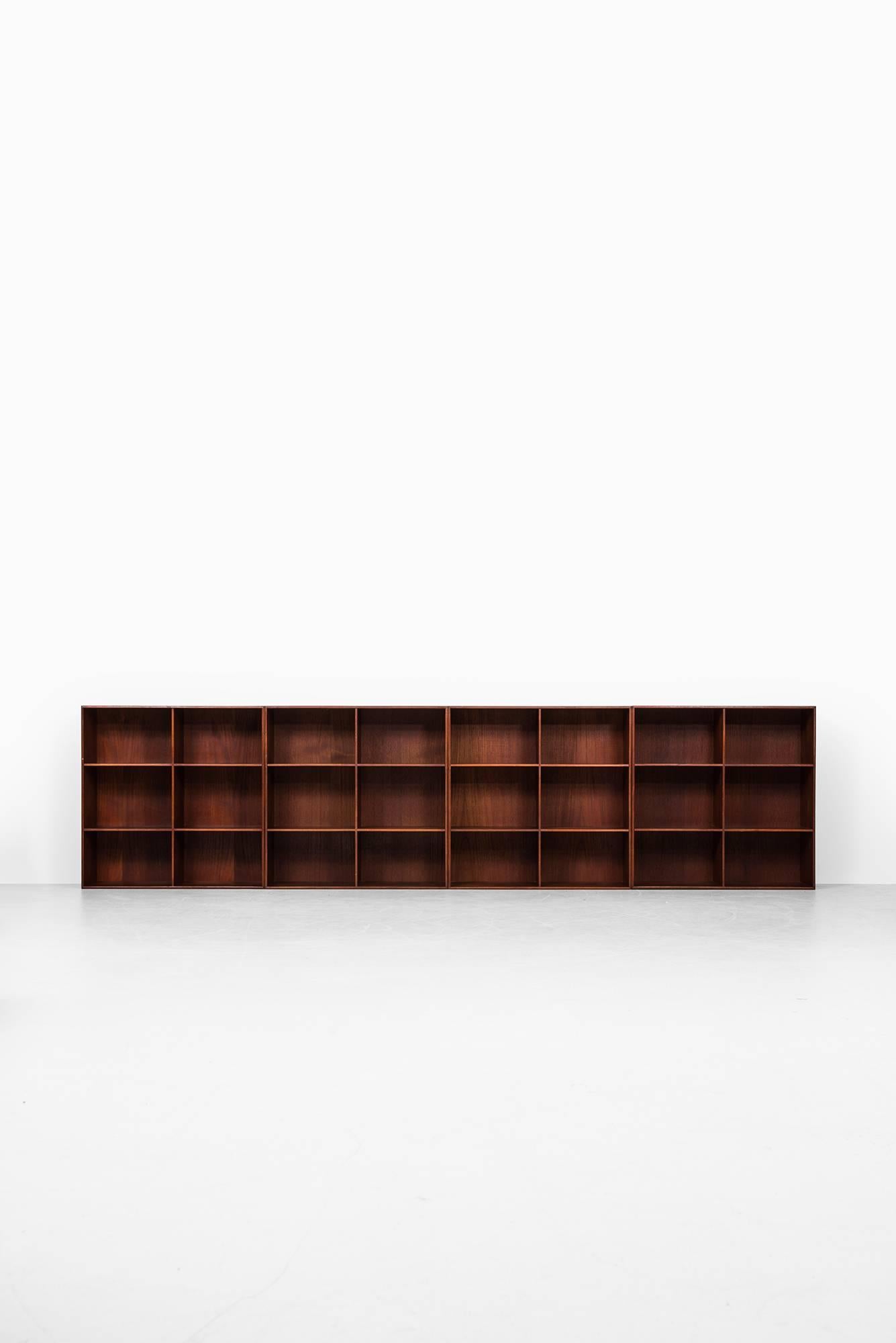 Set of four bookcases designed by Mogens Koch. Produced by Rud Rasmussen in Denmark.