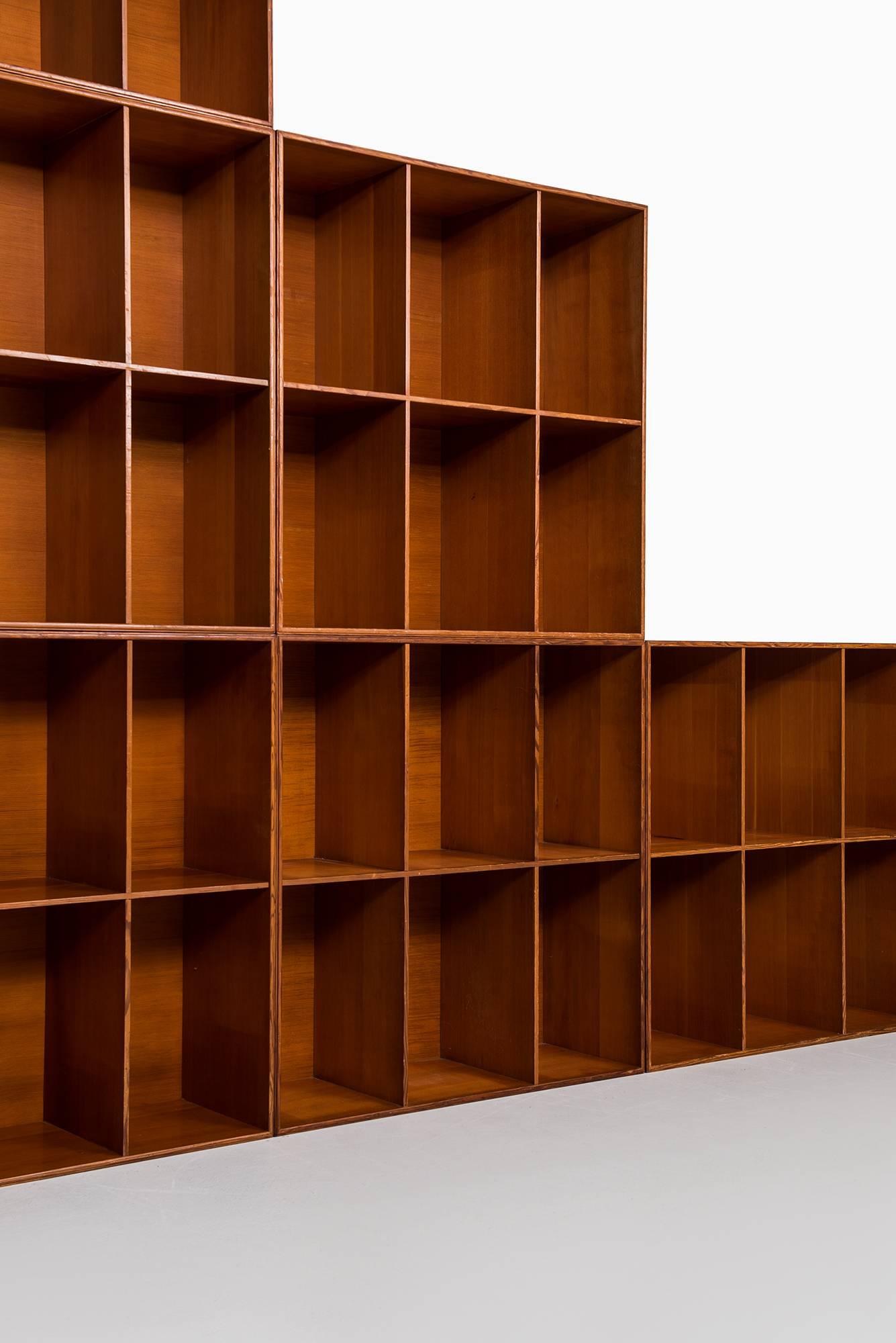 Set of six bookcases designed by Mogens Koch. Produced by Rud Rasmussen in Denmark.