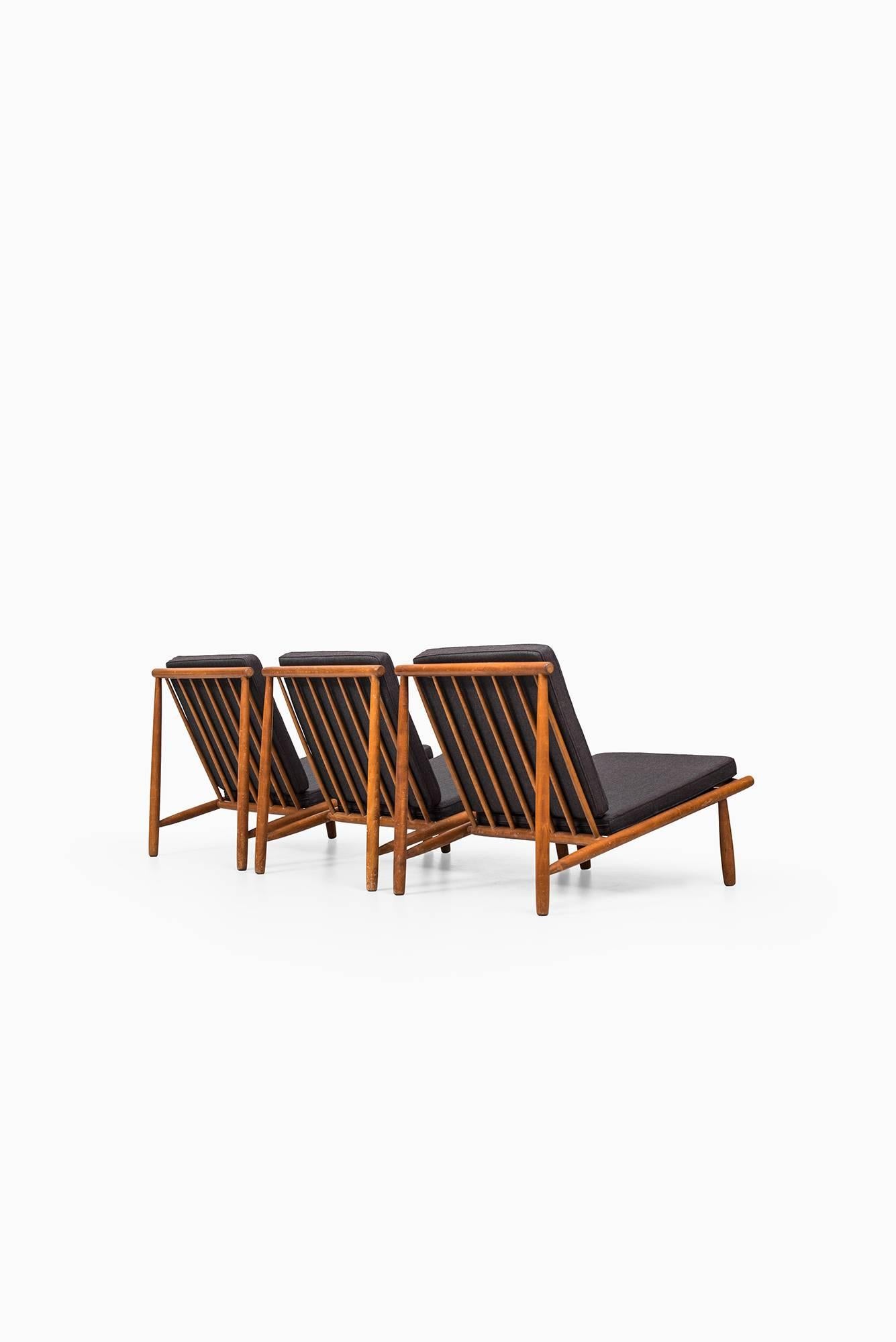 Set of three easy chairs model Domus designed by Alf Svensson. Produced by Dux in Sweden.