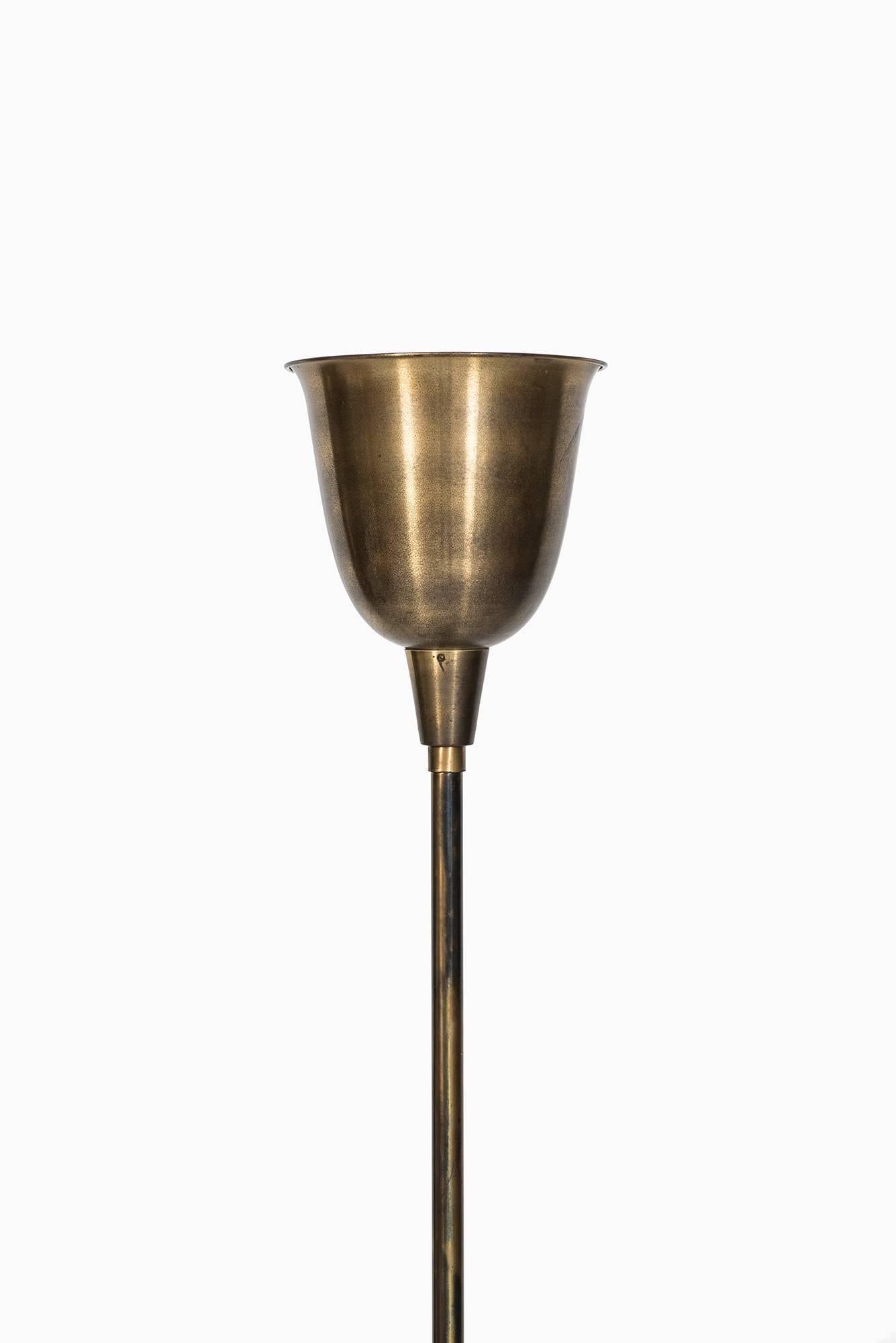 Floor lamp or uplight in brass produced in Denmark.