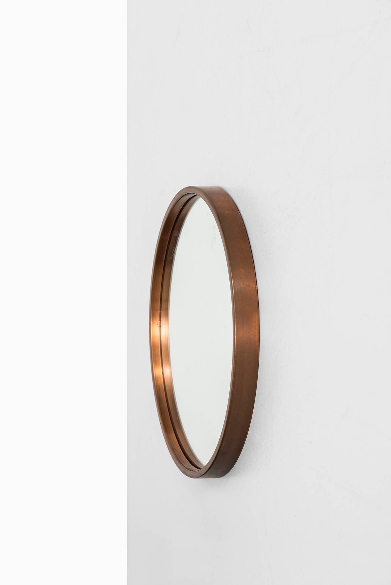 Round mirror in copper. Produced by Glas mäster in Markaryd, Sweden.