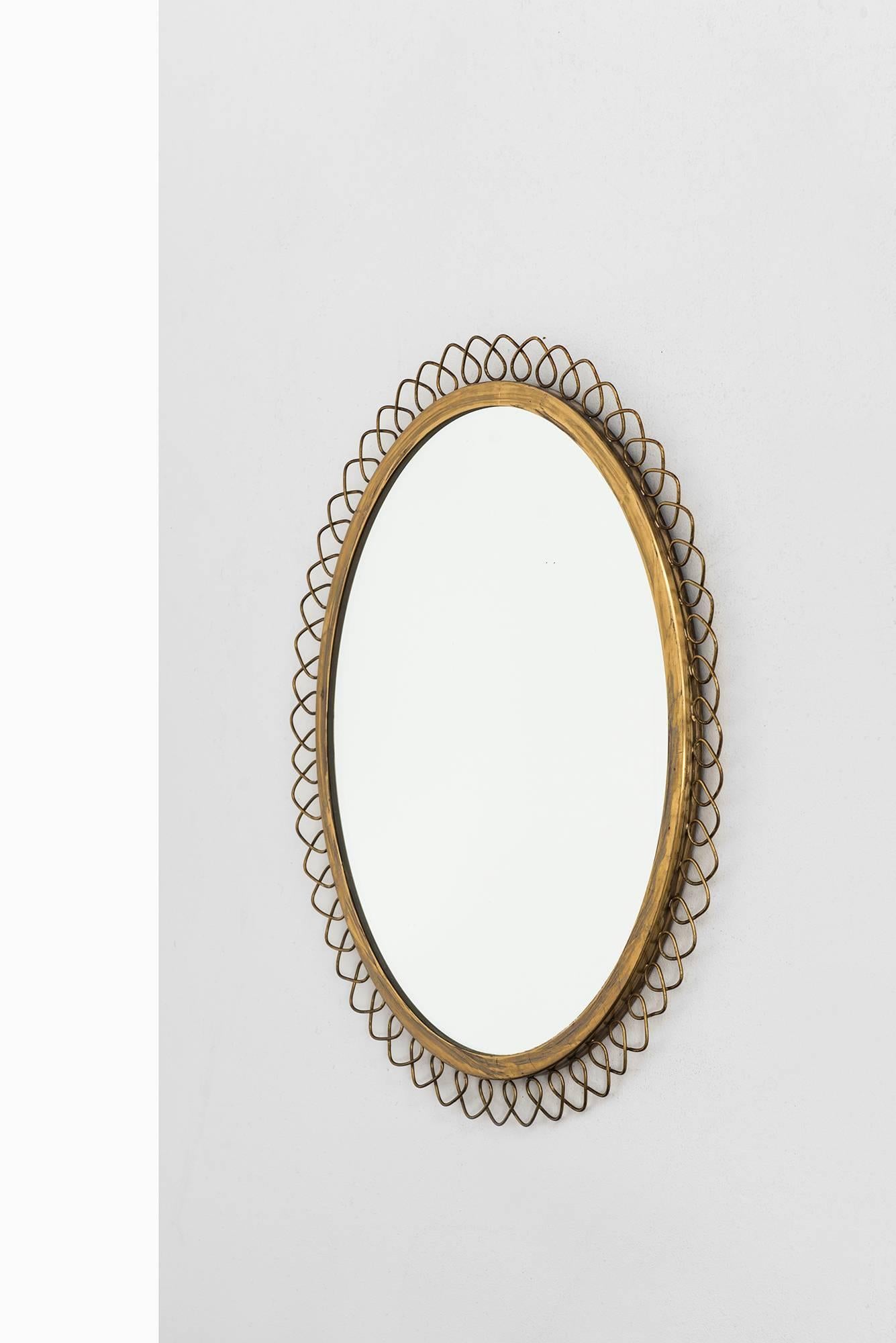 Mirror in brass in the manner of Josef Frank.