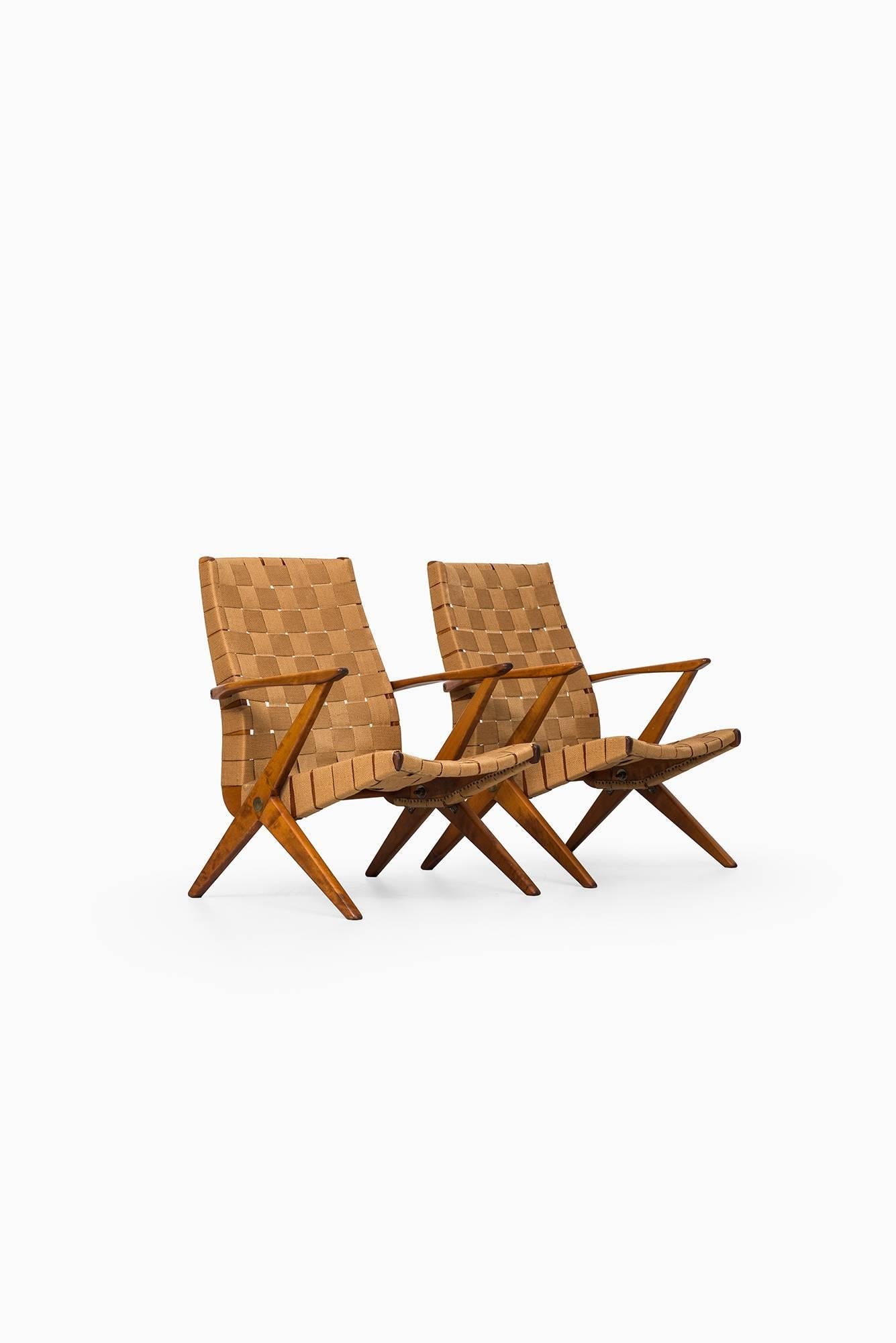 Rare pair of easy chairs designed by Bengt Ruda. Produced by Nordiska Kompaniet in Sweden.