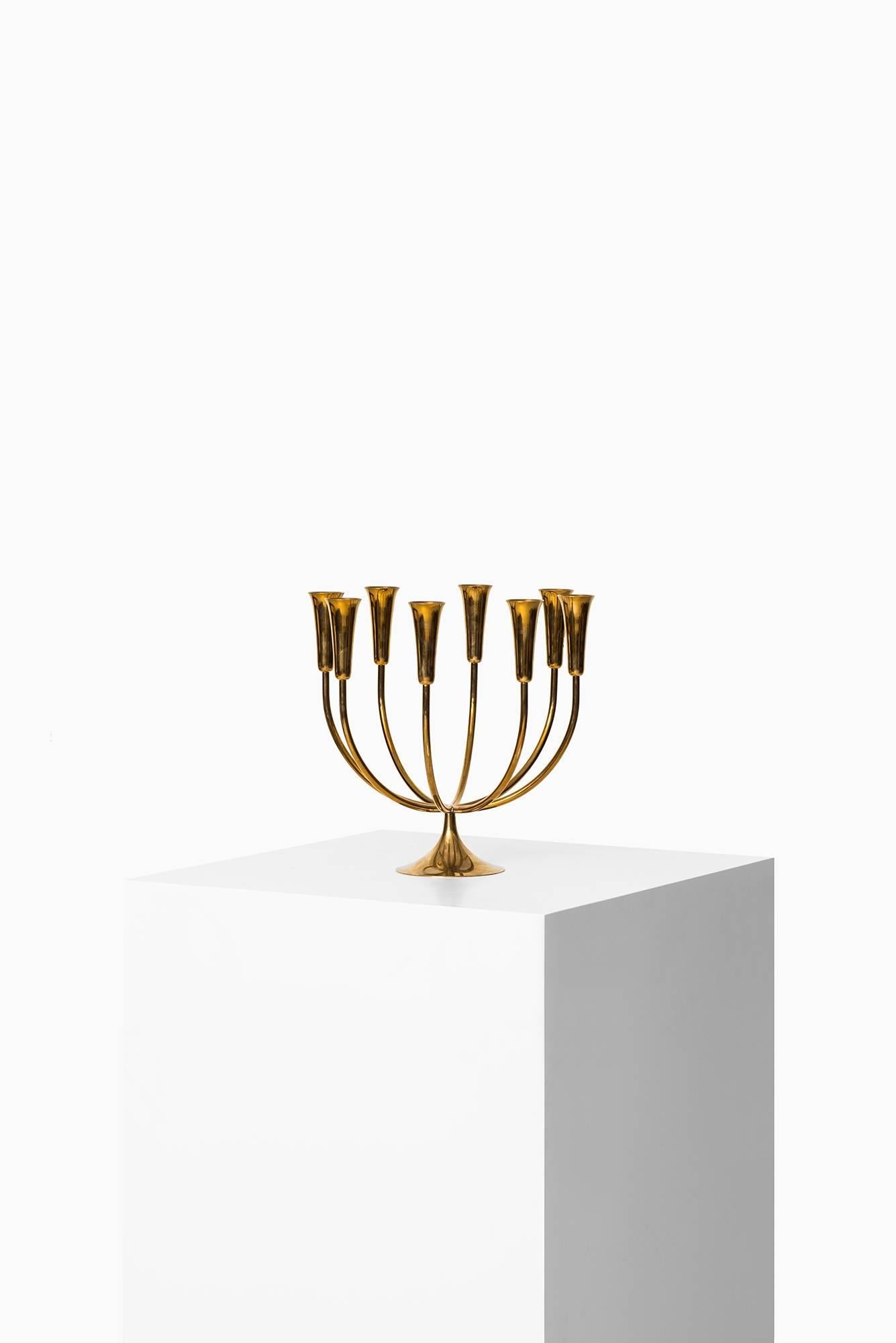 Rare large candleholder in brass attributed to Svend Aage Holm Sørensen. Produced by Illum Bolighus in Denmark.