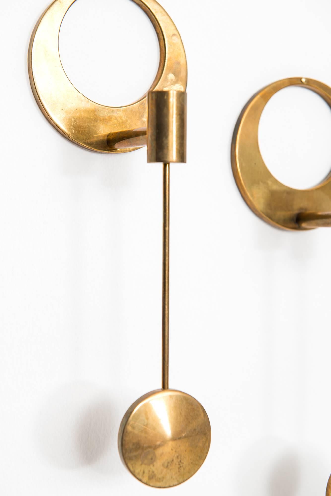 Rare wall hanged candlesticks designed by Arthur Pe. Produced by his own studio Kolbäck in Sweden.