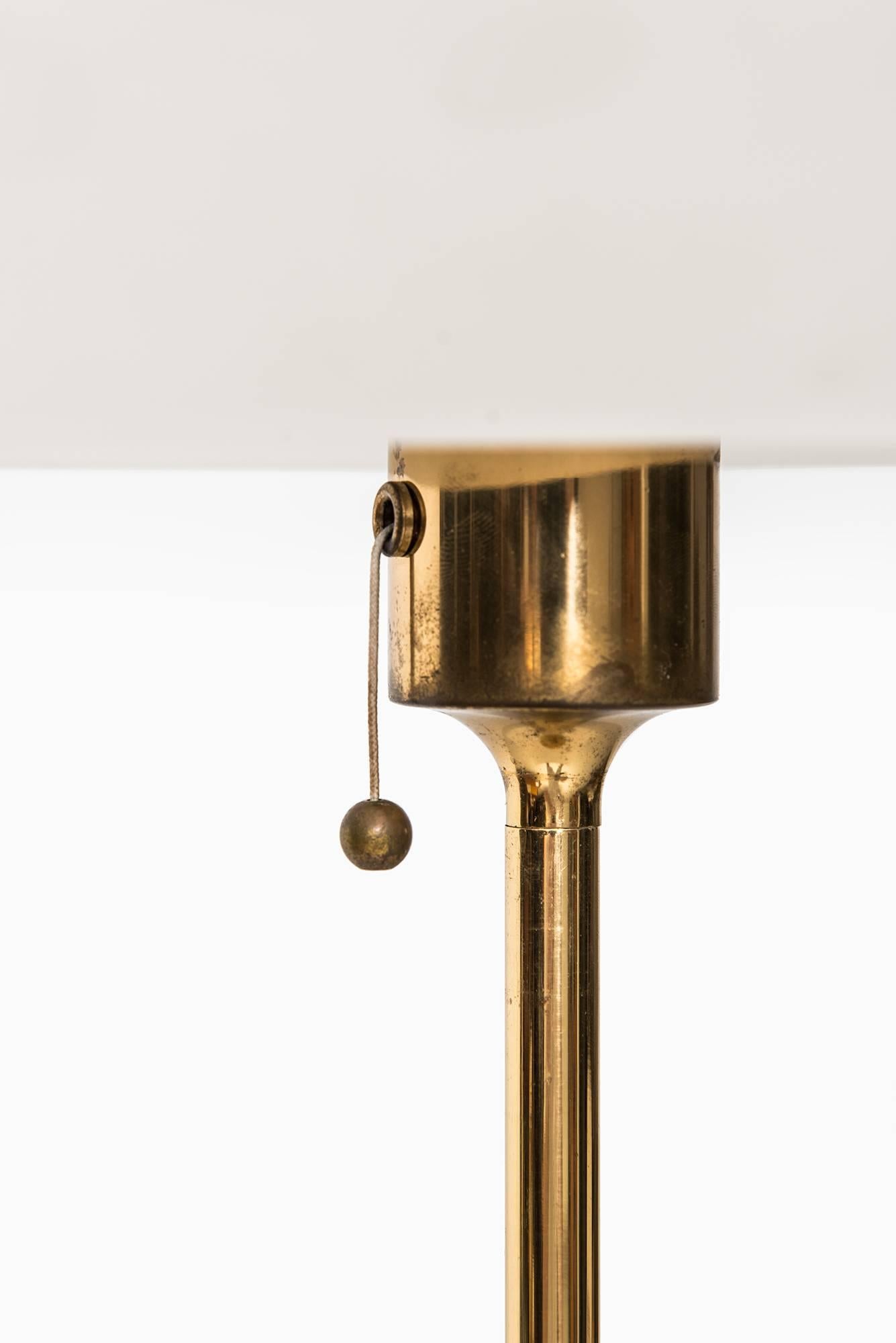 Rare height adjustable table lamp. Produced by Peill & Putzler in Germany.