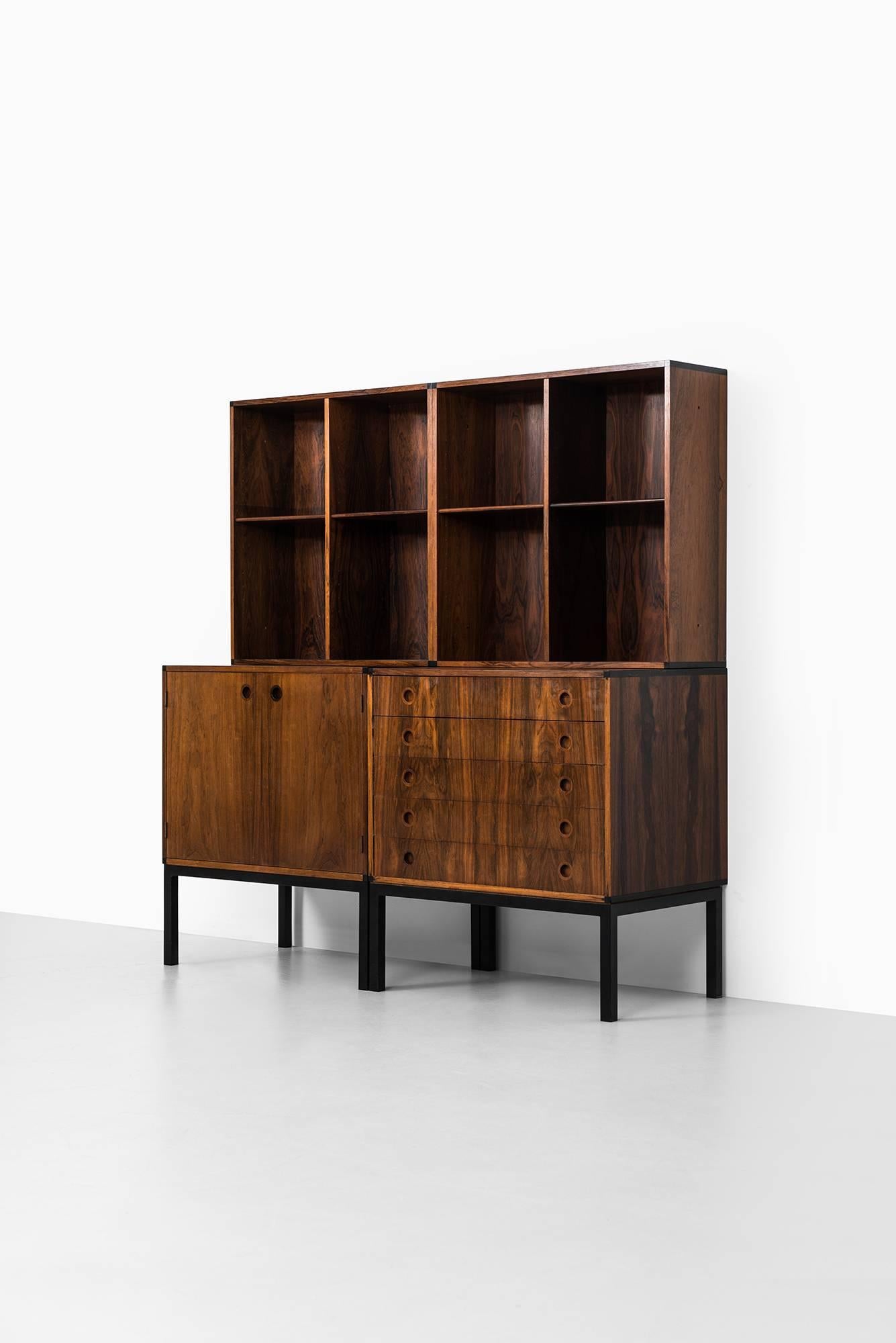 Storage unit designed by Hans Hove & Palle Petersen. Produced by Christian Linneberg in Denmark.

Dimensions cabinet (W x D x H): 64 x 44 x 70 cm
Dimensions bookcase (W x D x H): 64 x 22 x 64 cm.