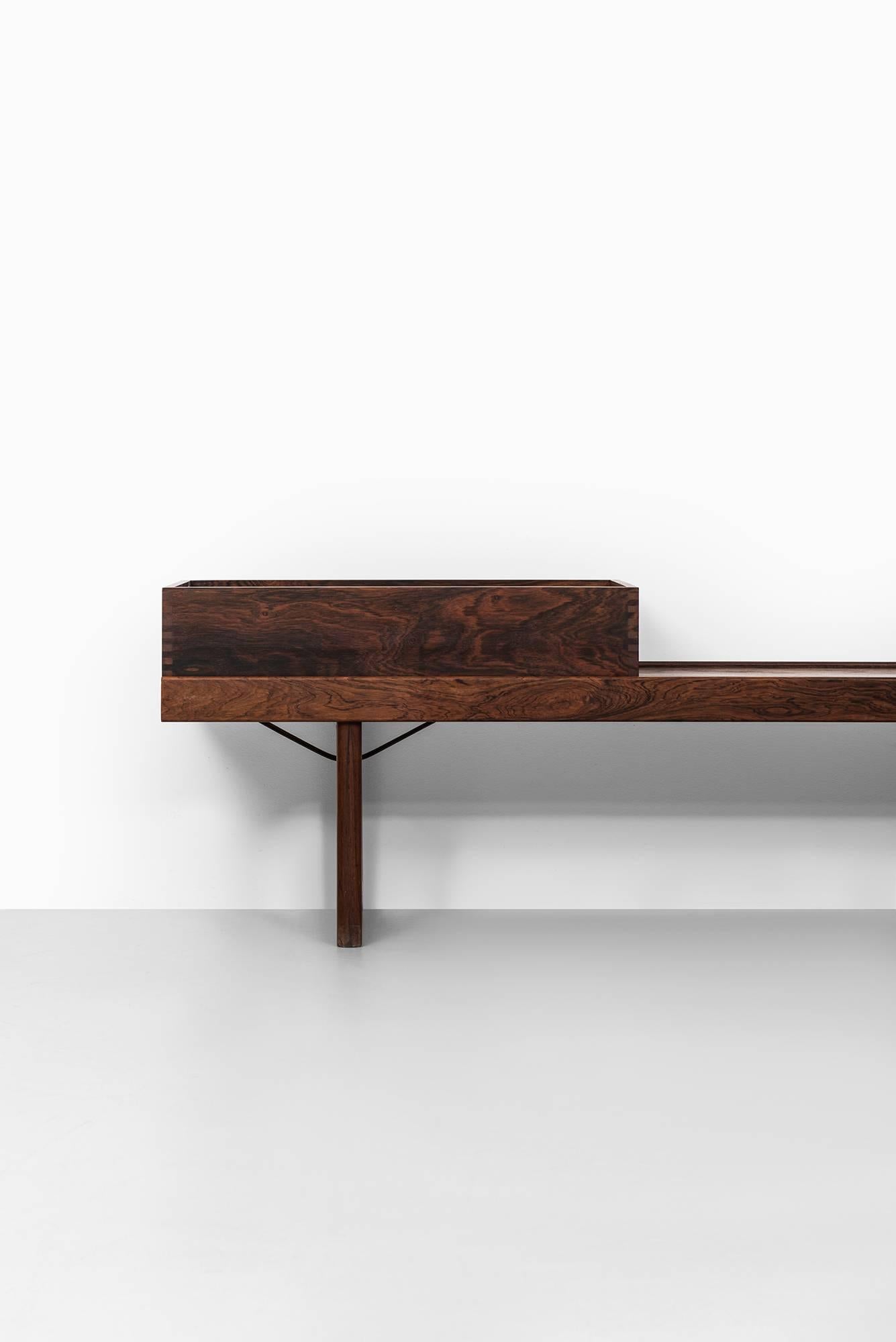 Bench or side table with flower box model Krobo designed by Torbjørn Afdal. Produced by Bruksbo in Norway.