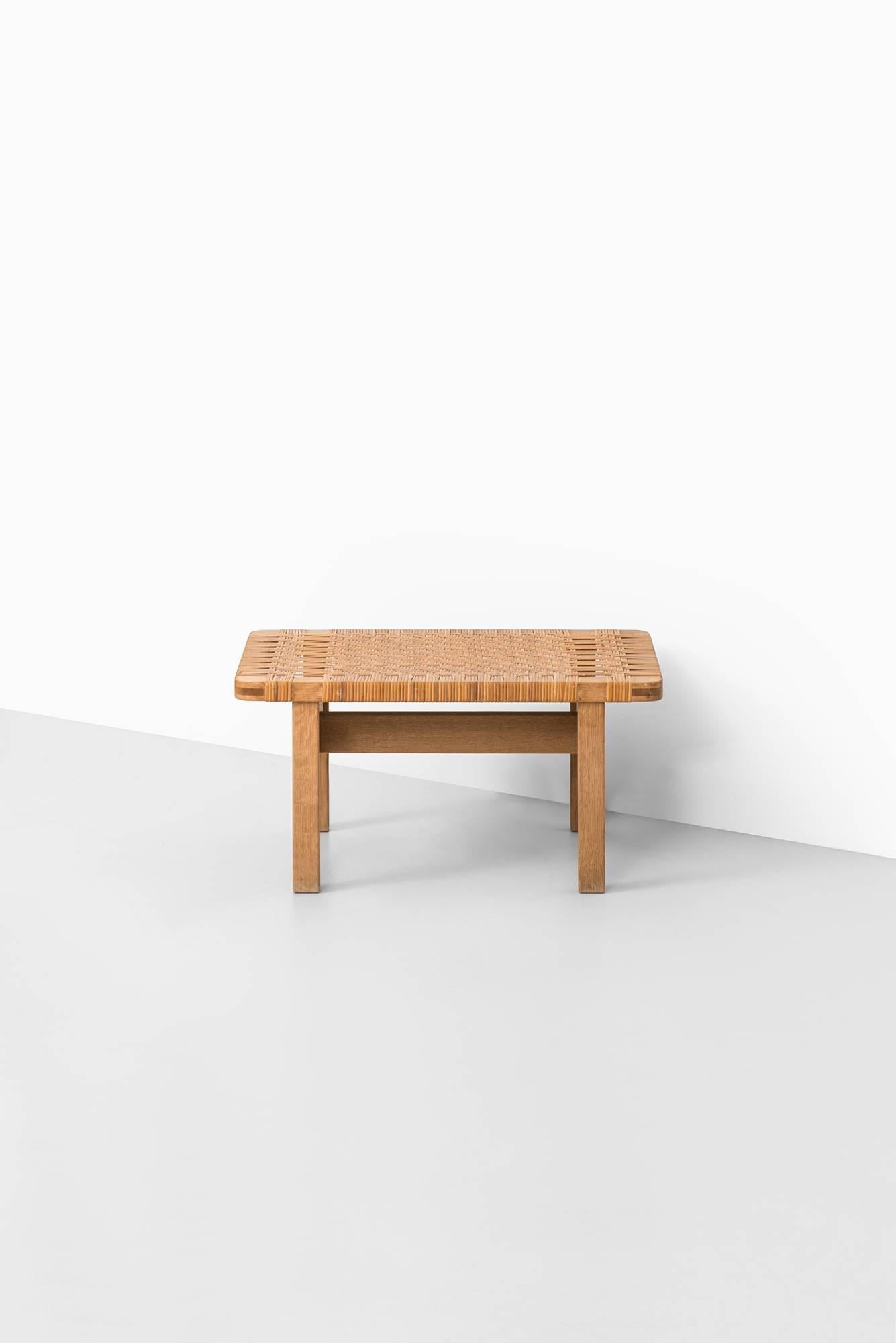 Rare side table in oak and cane designed by Børge Mogensen. Produced by Fredericia stolefabrik in Denmark.