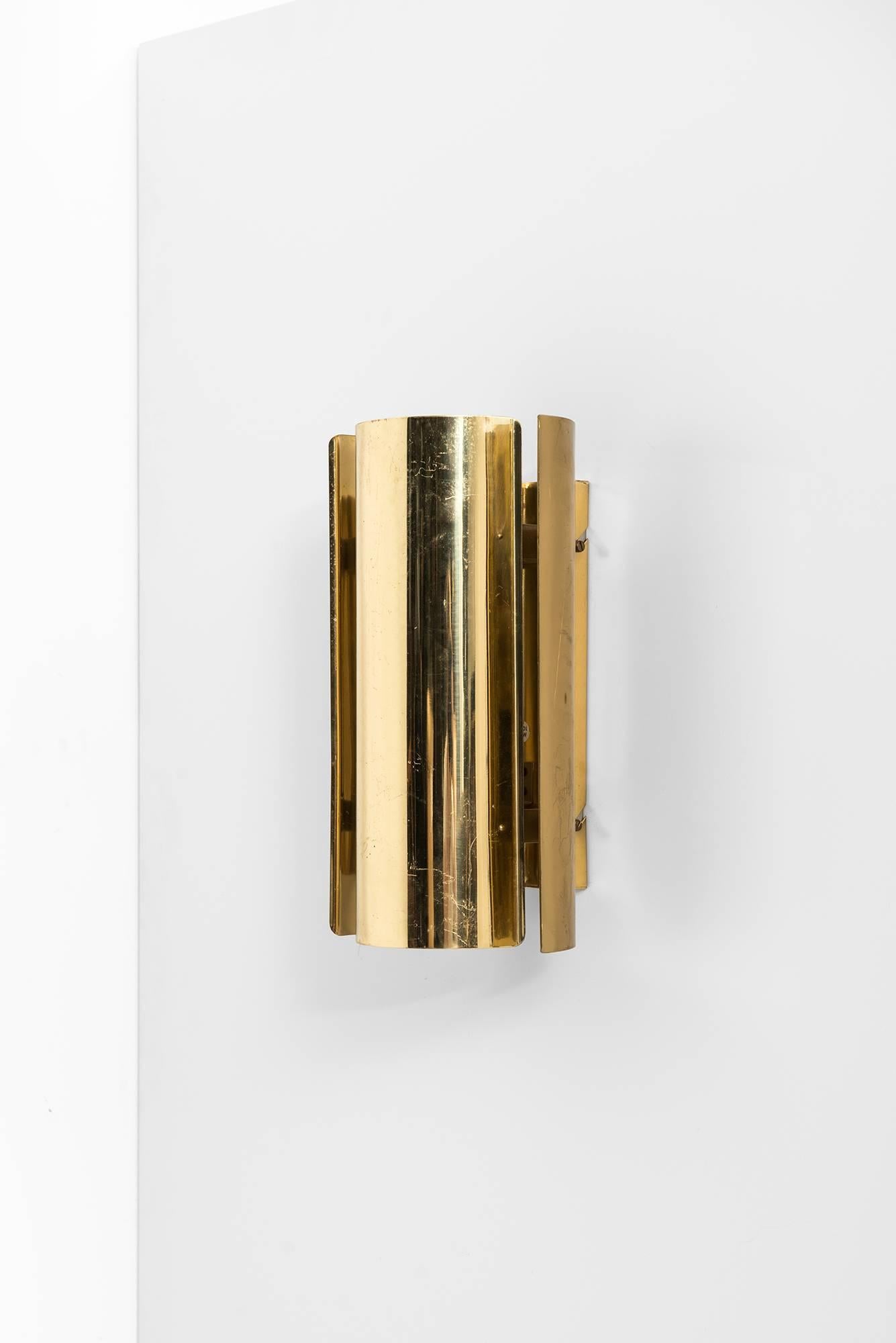Rare wall lamps in brass. Produced by Falkenbergs belysnings AB in Sweden.