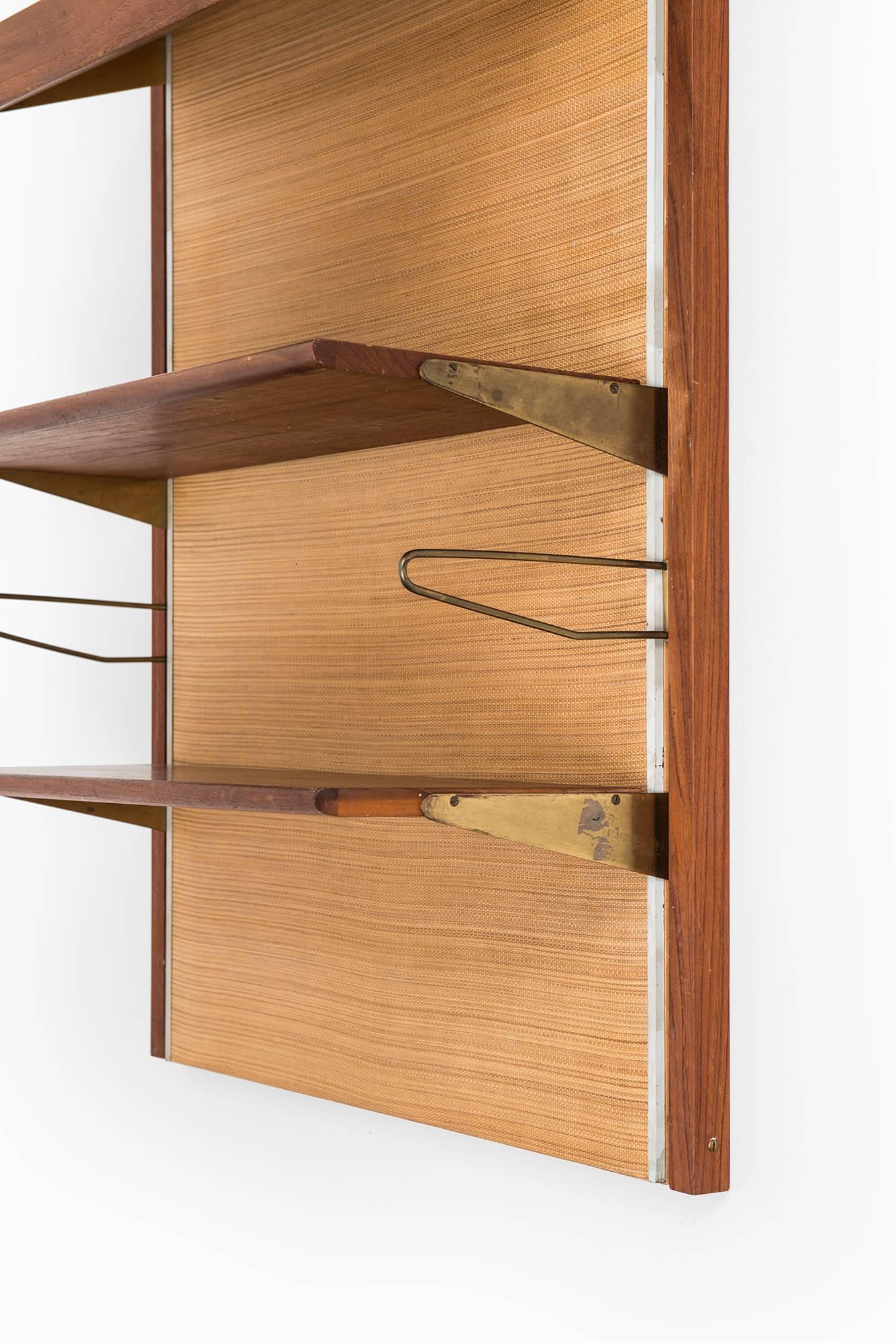Rare wall-mounted bookcase designed by Finn Juhl. Produced by Bovirke in Denmark.