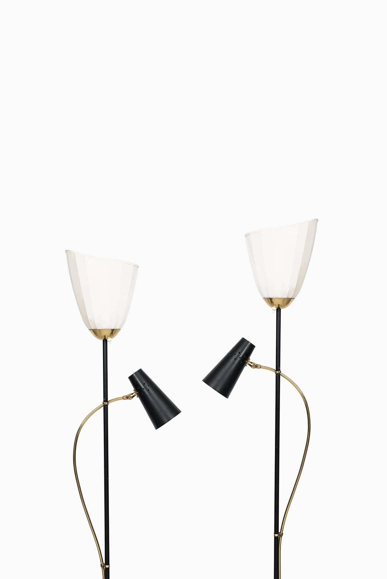 Rare pair of floor lamps produced in Sweden.