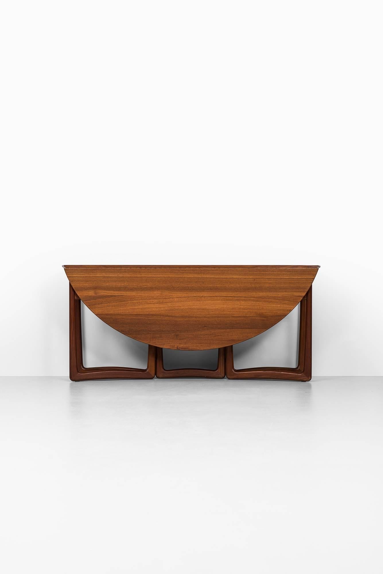 Rare drop-leaf dining / console table designed by Peter Hvidt & Orla Mølgaard-Nielsen. Produced by France & Son in Denmark.