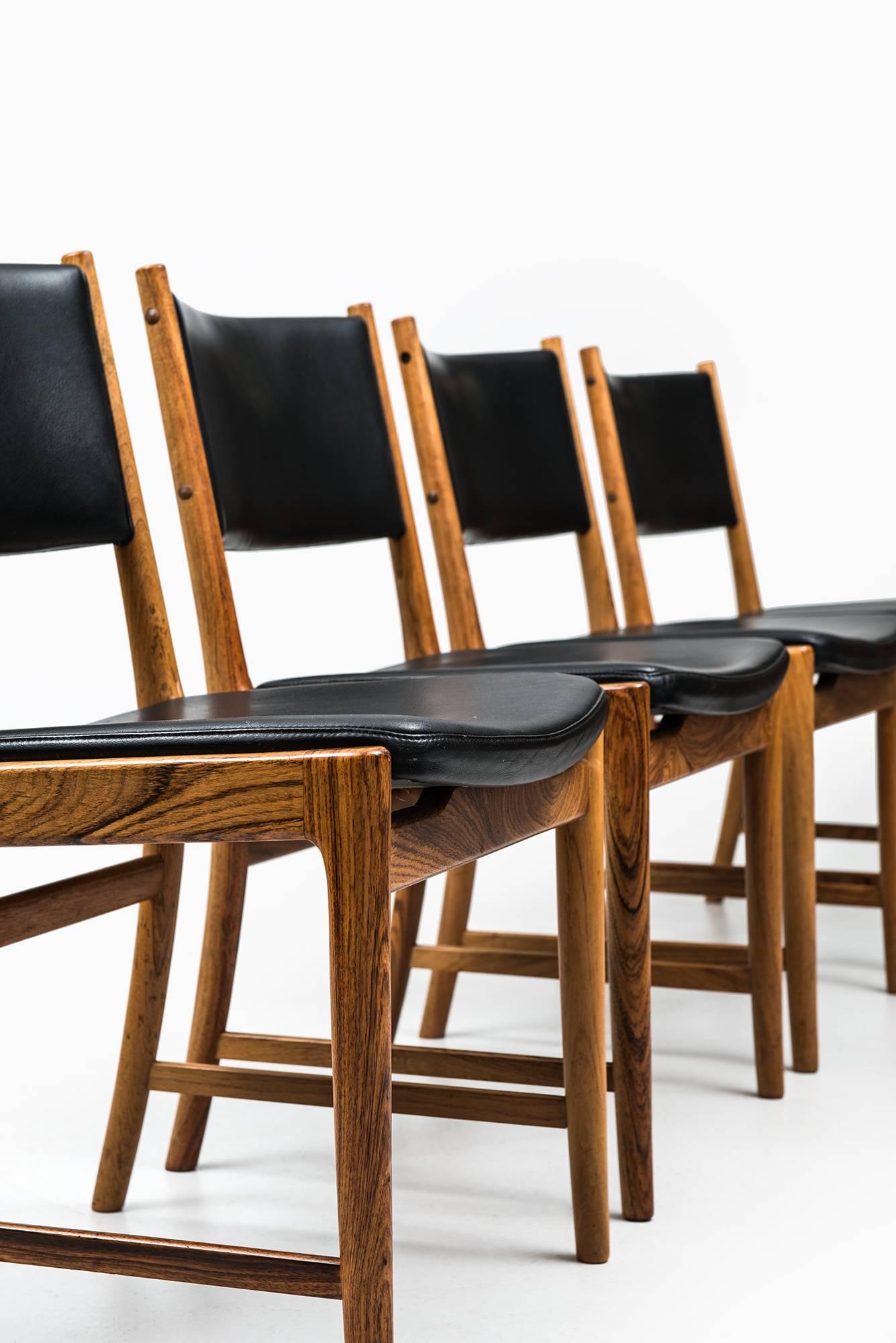 Rare set of eight dining chairs designed by Kai Lyngfeldt Larsen. Produced in Søren Willadsen in Denmark.