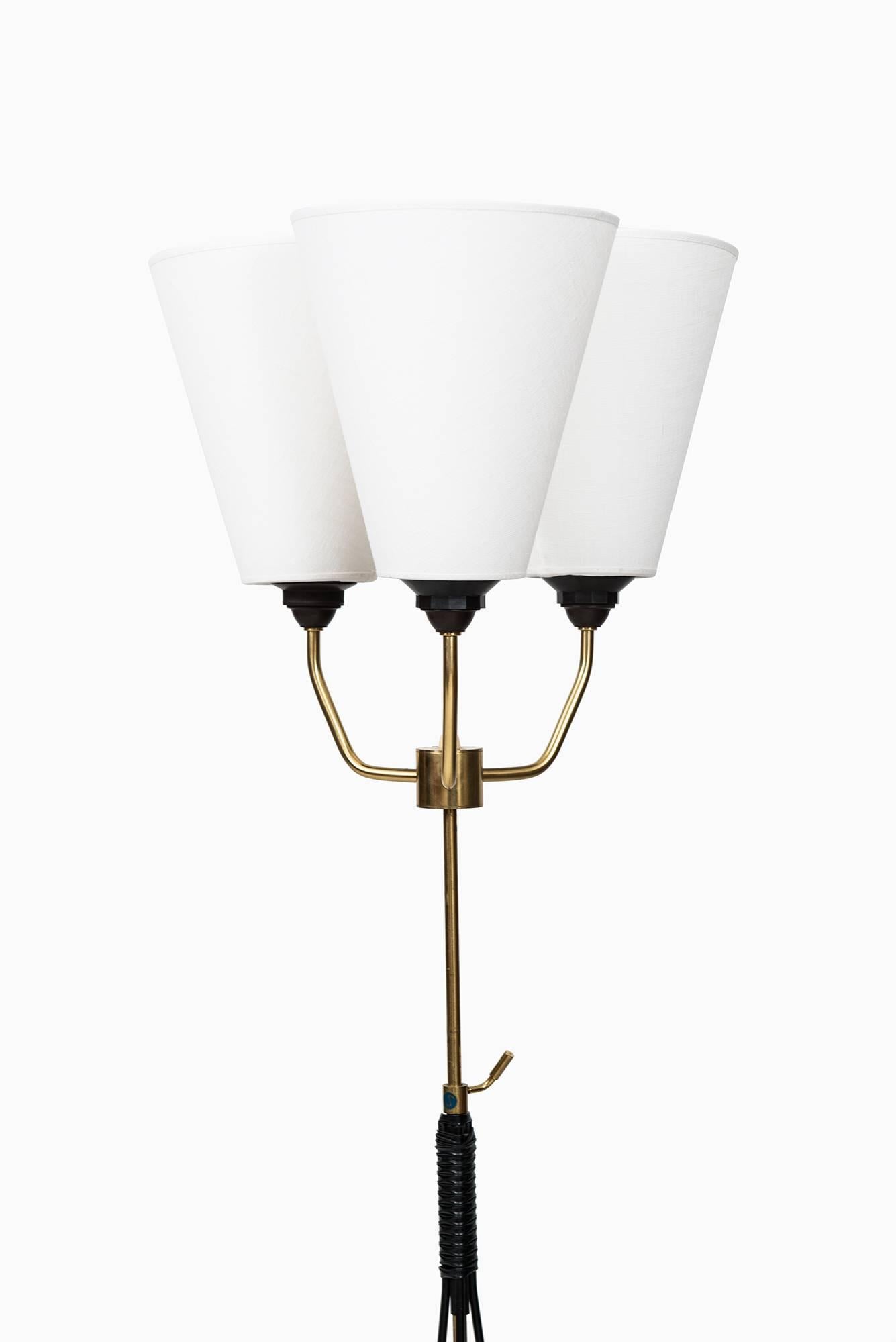 A pair of height adjustable uplights/floor lamps. Produced in Sweden.