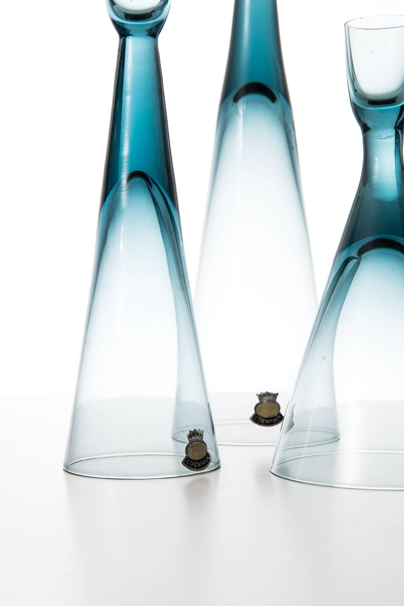 Set of 3 candlesticks in glass designed by Bengt Edenfalk. Produced by Skruf glasbruk in Sweden.