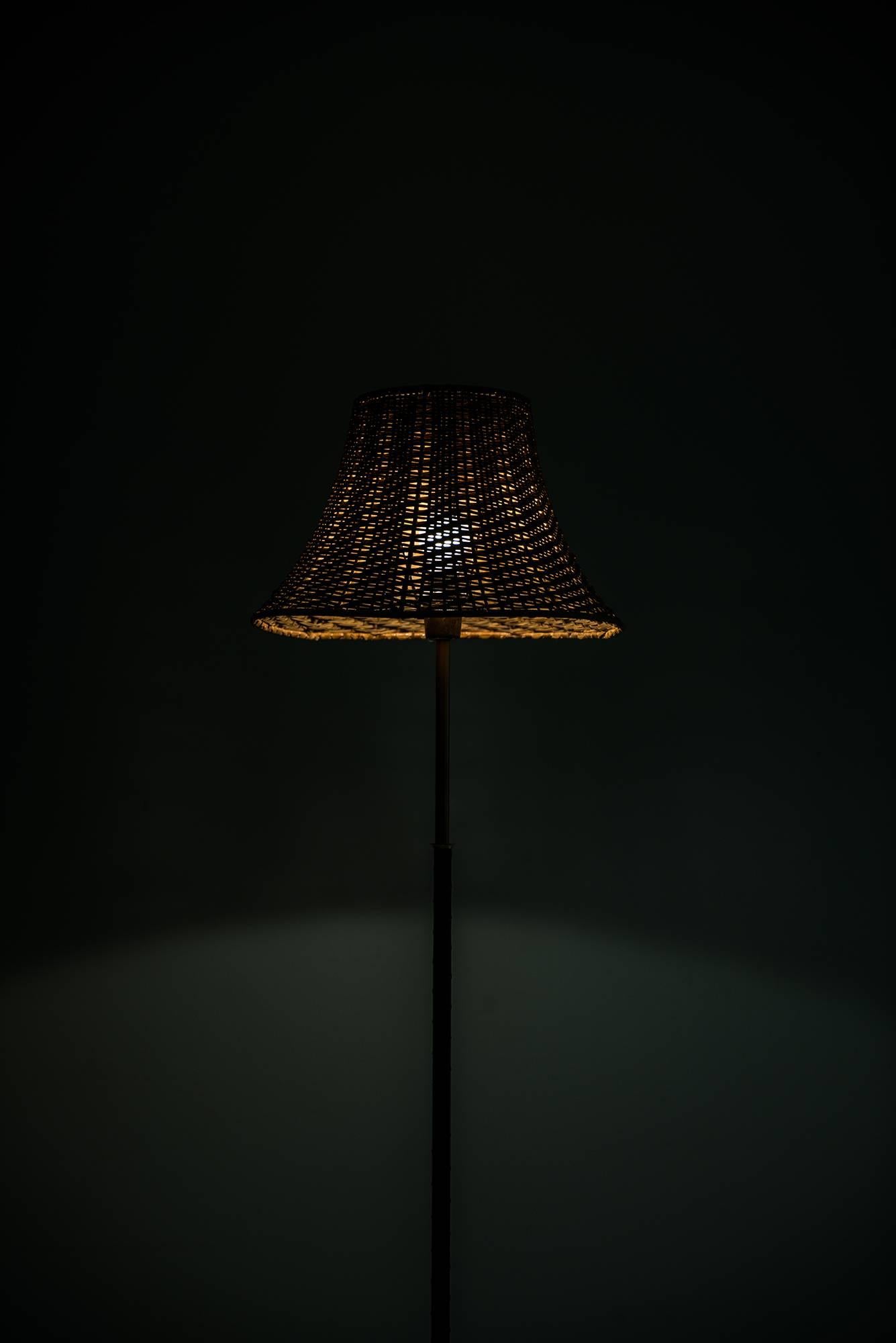 Floor Lamp in Black Leather, Brass and Woven Cane Shade Produced in Sweden In Excellent Condition In Limhamn, Skåne län