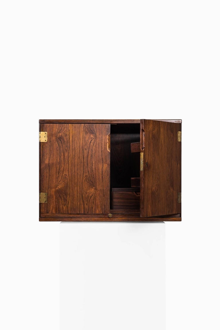 Rare wall mounted bar cabinet designed by Svend Langkilde. Produced by Langekilde møbler in Denmark.