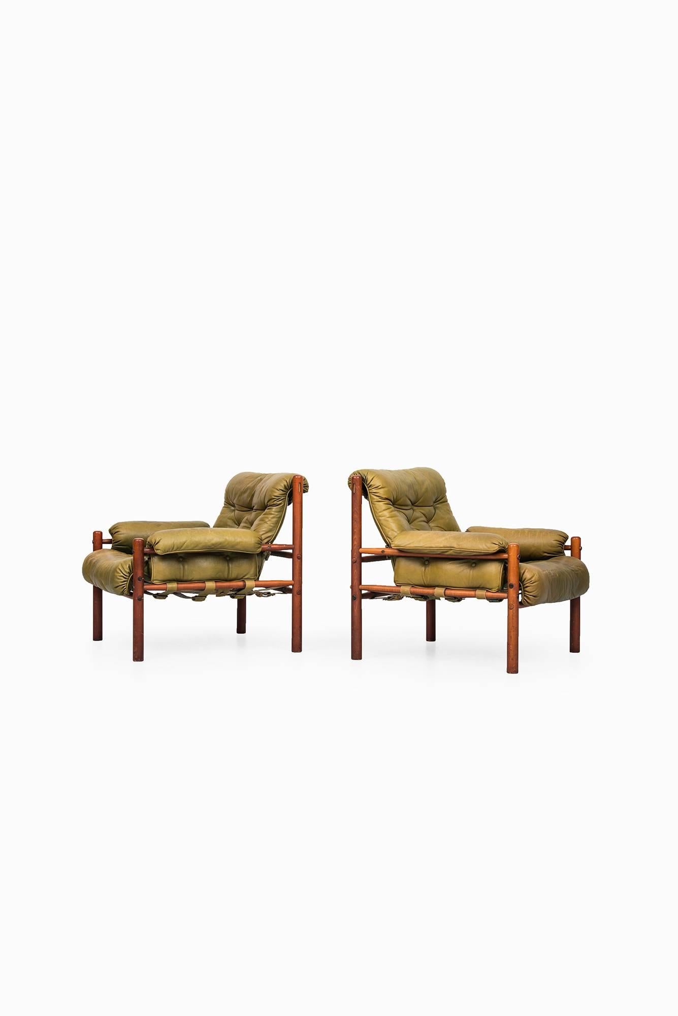 A pair of easy chairs designed by Arne Norell. Produced by Arne Norell AB in Aneby, Sweden.