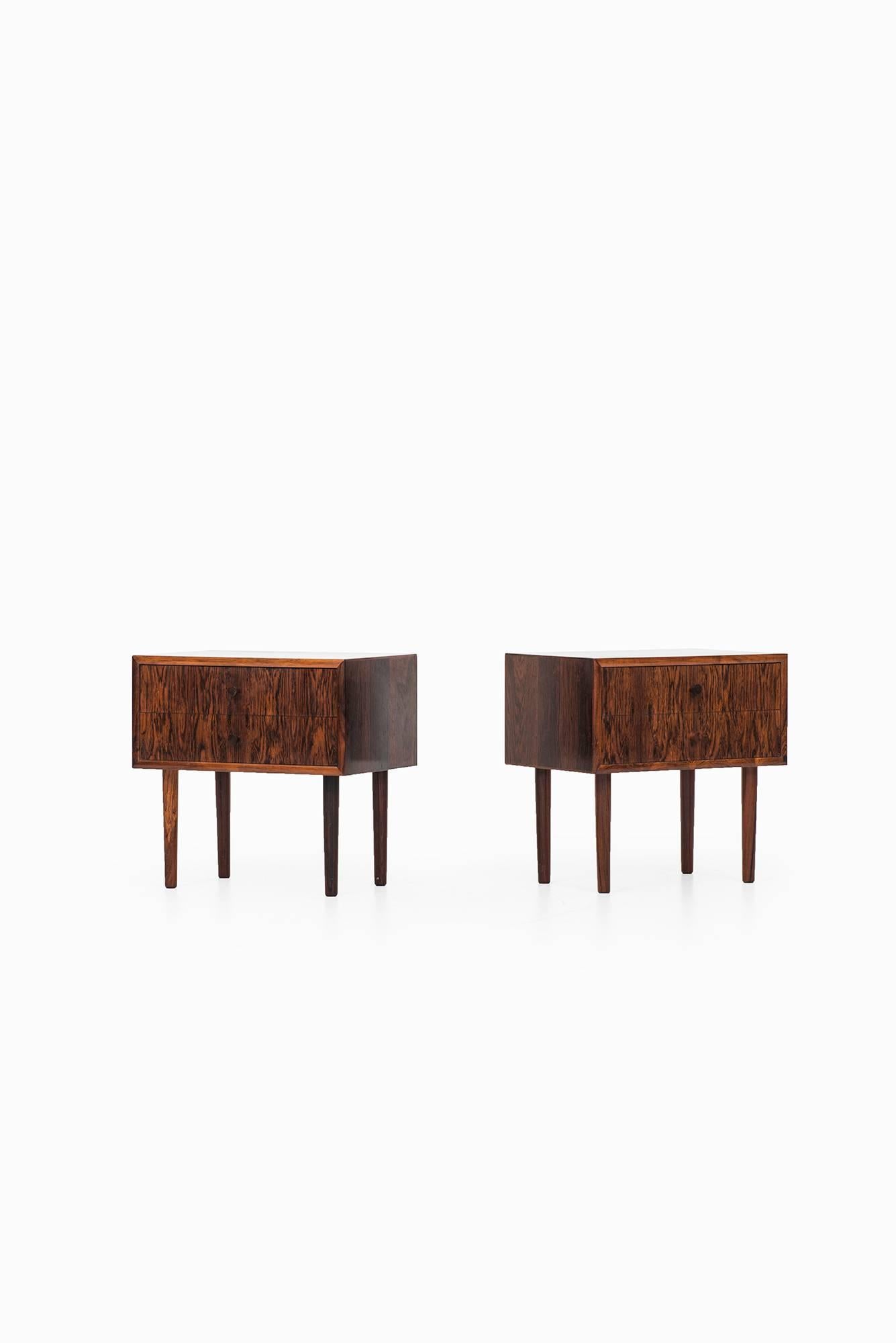 A pair of bedside tables / side tables in rosewood. Produced in Denmark.
