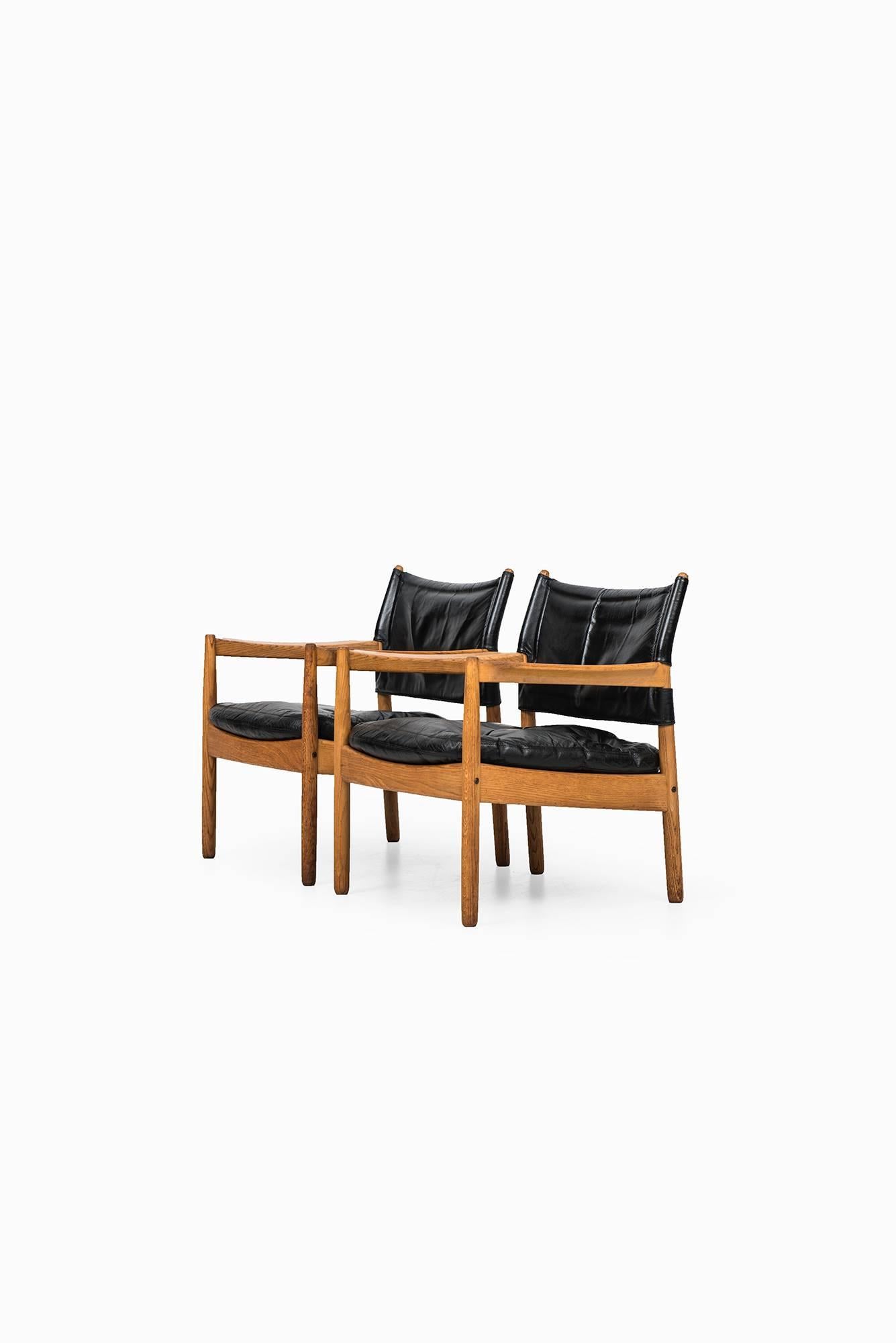 A pair of easy chairs designed by Gunnar Myrstrand. Produced by Källemo in Sweden.
