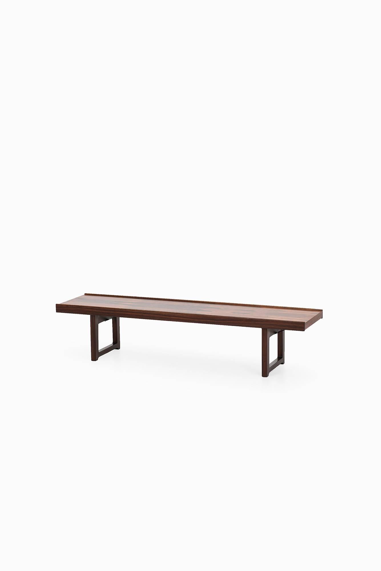Bench / side table model Krobo in rosewood designed by Torbjørn Afdal. Produced by Bruksbo in Norway.