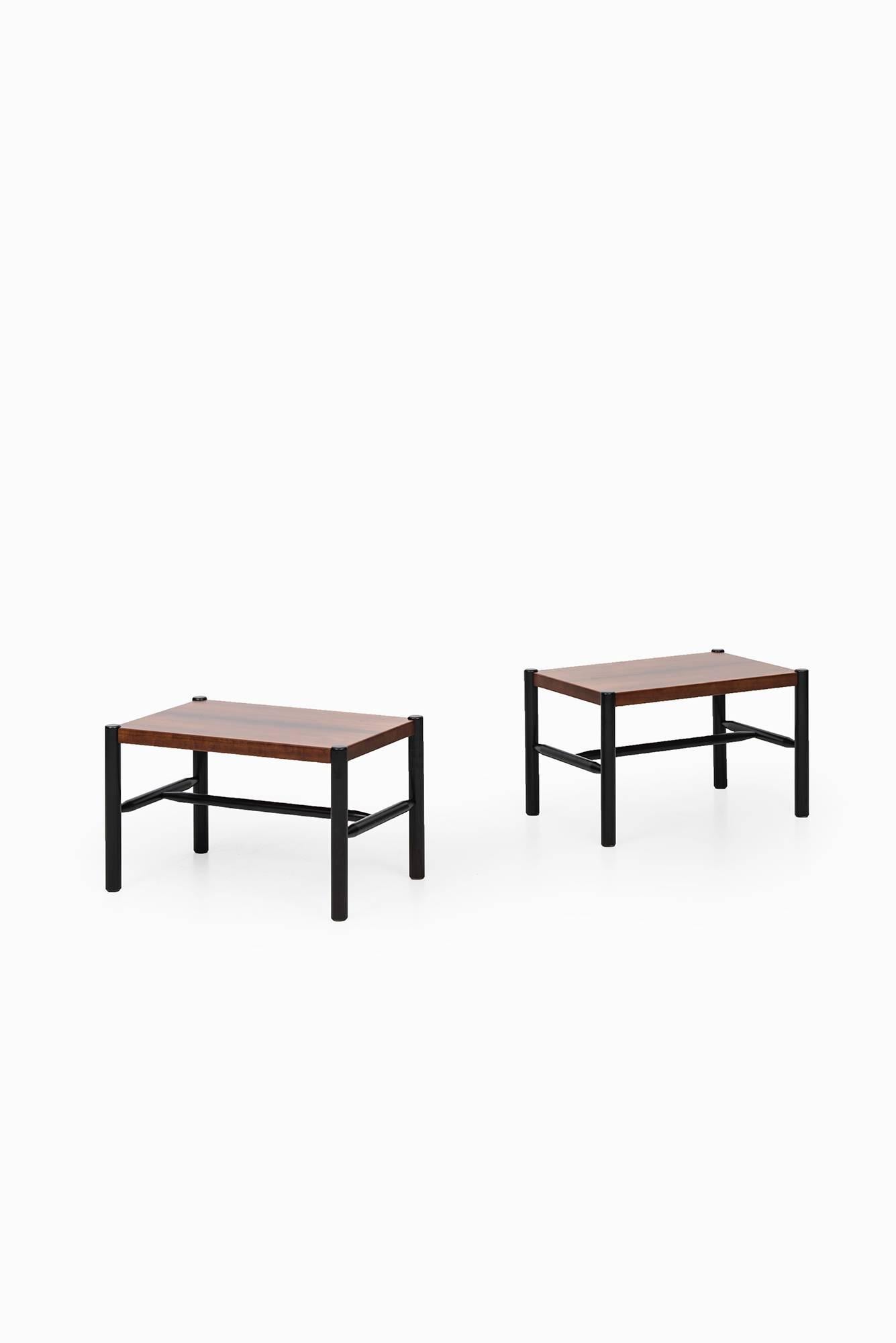 Rare pair of side tables designed by Arne Norell. Produced by Arne Norell AB in Aneby, Sweden. Matching coffee table is also available. 
