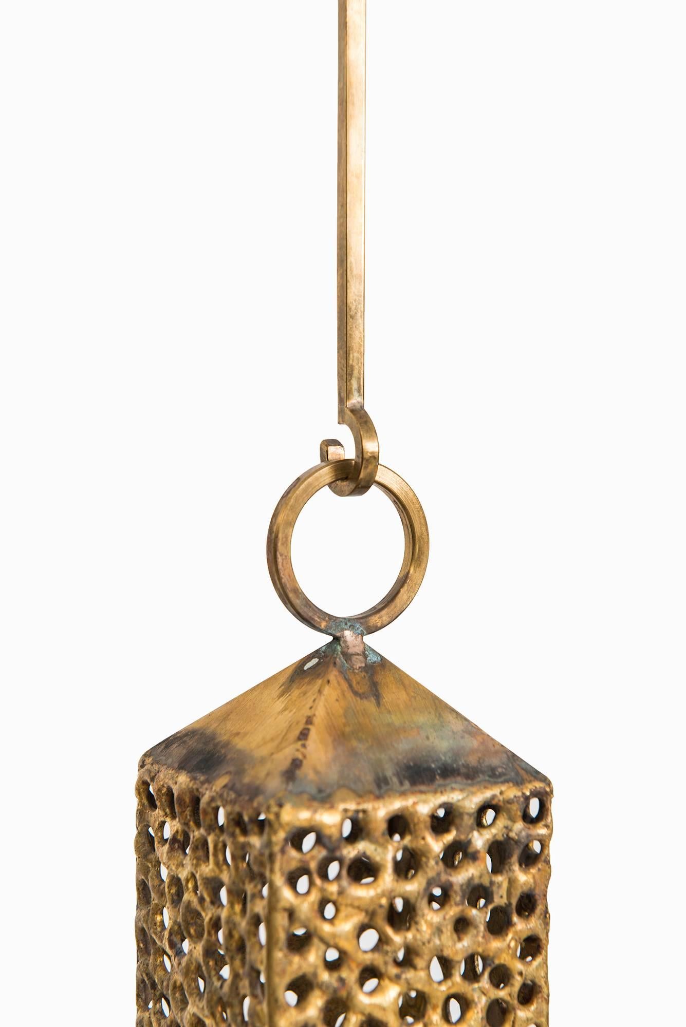 Rare hanging lantern in brass designed by Pierre Forsell. Produced by Skultuna in Sweden.
