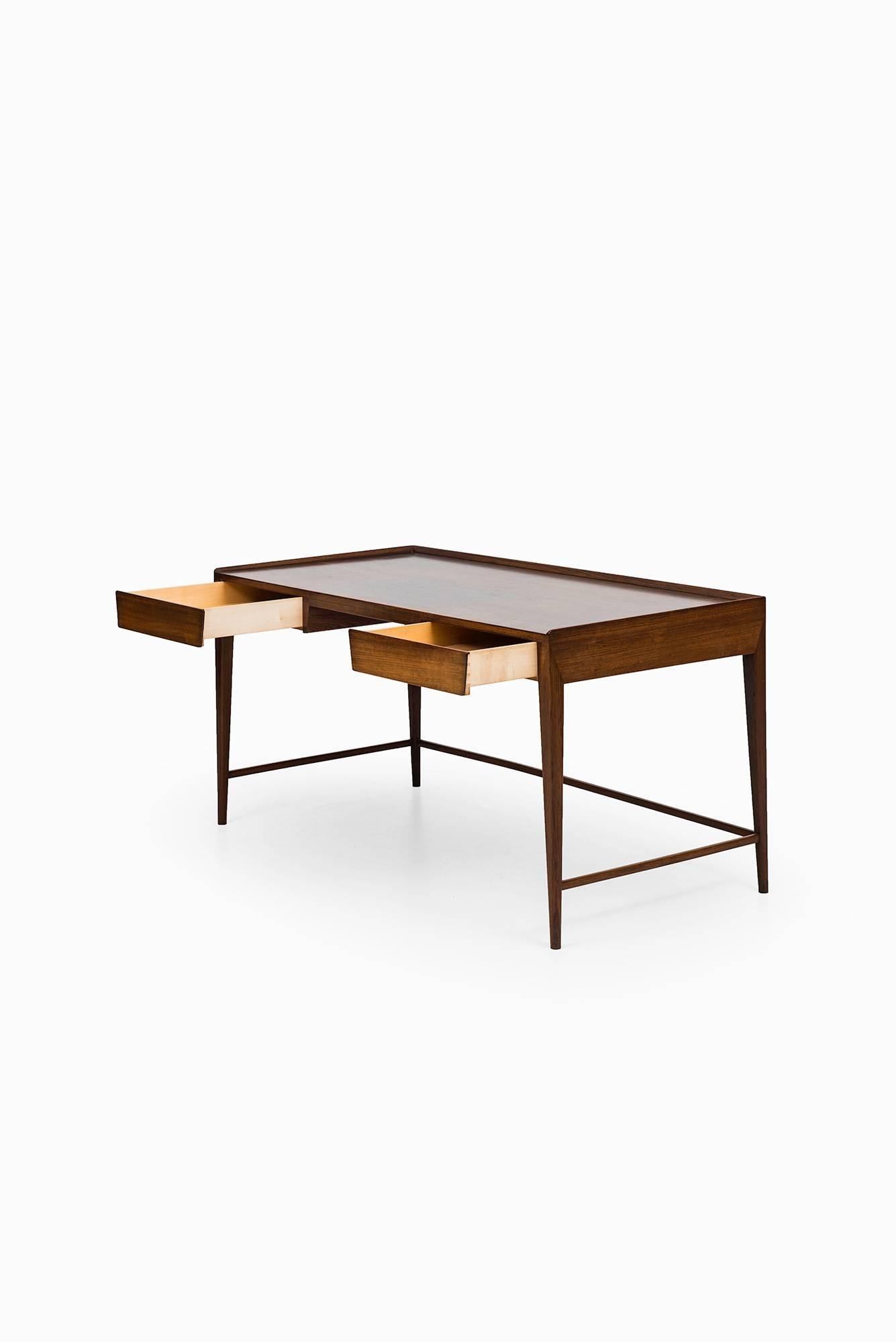 Mid-20th Century Frode Holm desk in rosewood by Illums Bolighus in Denmark